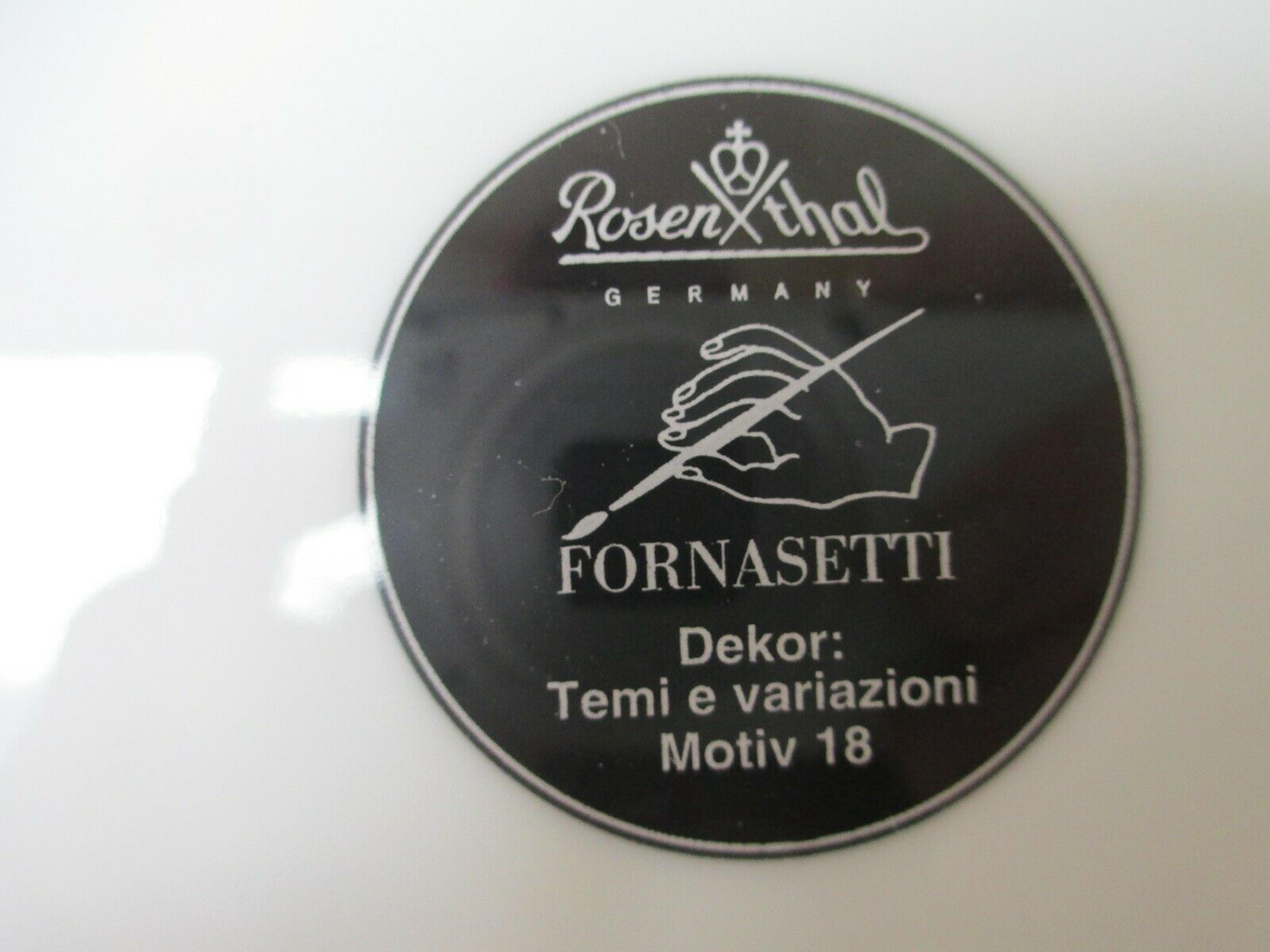 Vintage Rosenthal Fornasetti plate,
Motiv 18,
Lina Cavalieri,
1980s

The striking Rosenthal Fornasetti gold-rimmed black and white printed plate depicts the face of Lina Cavalieri amongst clouds.

Diameter: 9 1/4 inches

During the 1980s