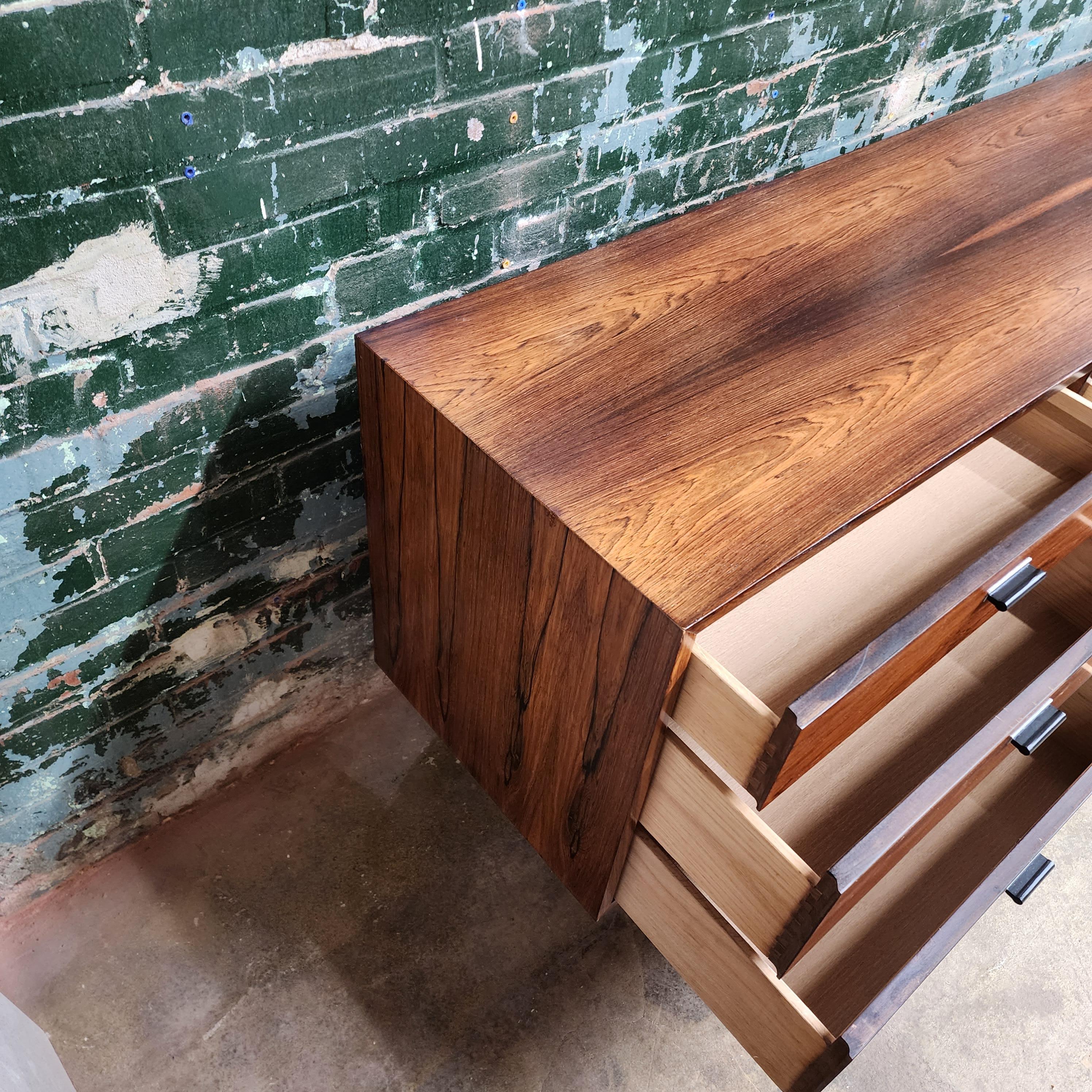 Beautiful Brazilian Rosewood 9 drawer dresser by Jack Cartwright for Founders Furniture. 
Jack Cartwright was a renowned designer who created many timeless pieces of furniture, including this 9-drawer dresser made of rosewood for Founders