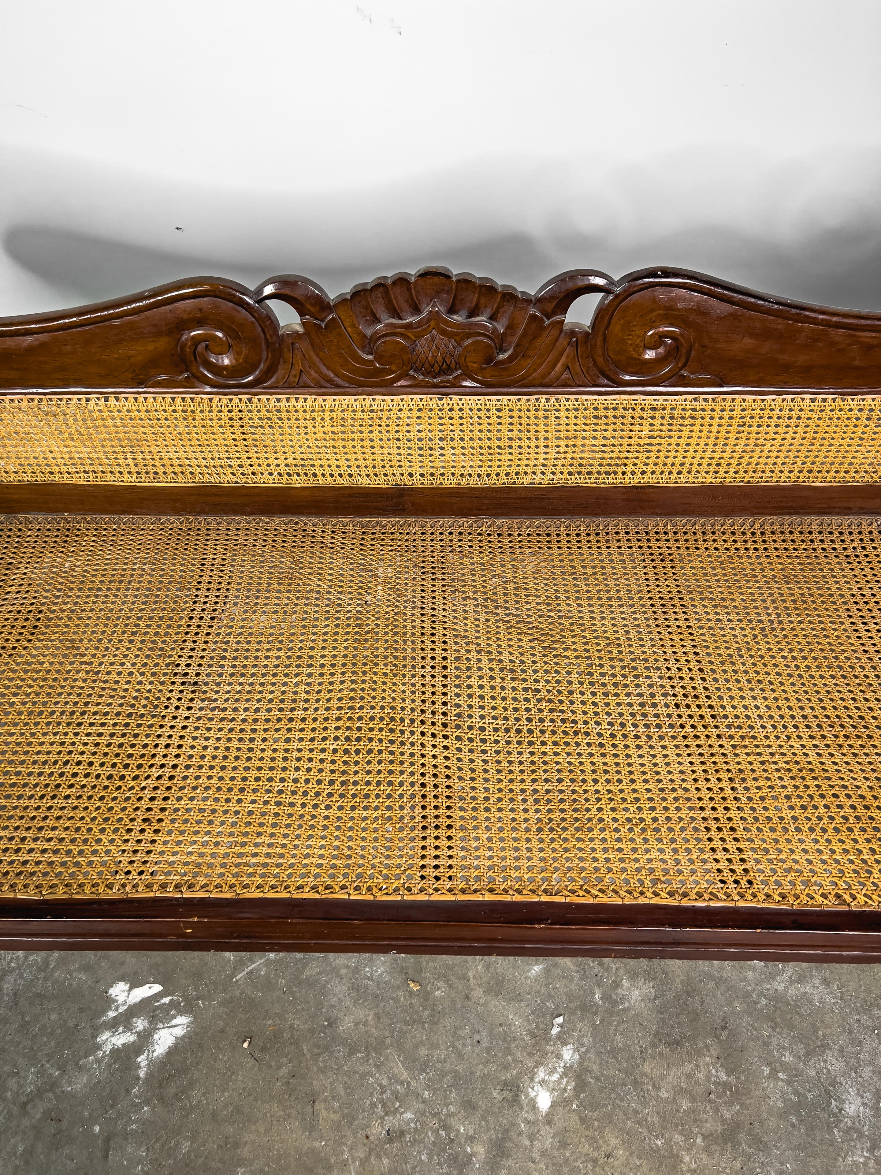 Vintage Rosewood and caned Indonesian Dutch Colonial style settee/sofa.  We were told by the family of the owner that this was a prized possession of their mother.  The children were not allowed anywhere near to the settee.  This is obvious in that
