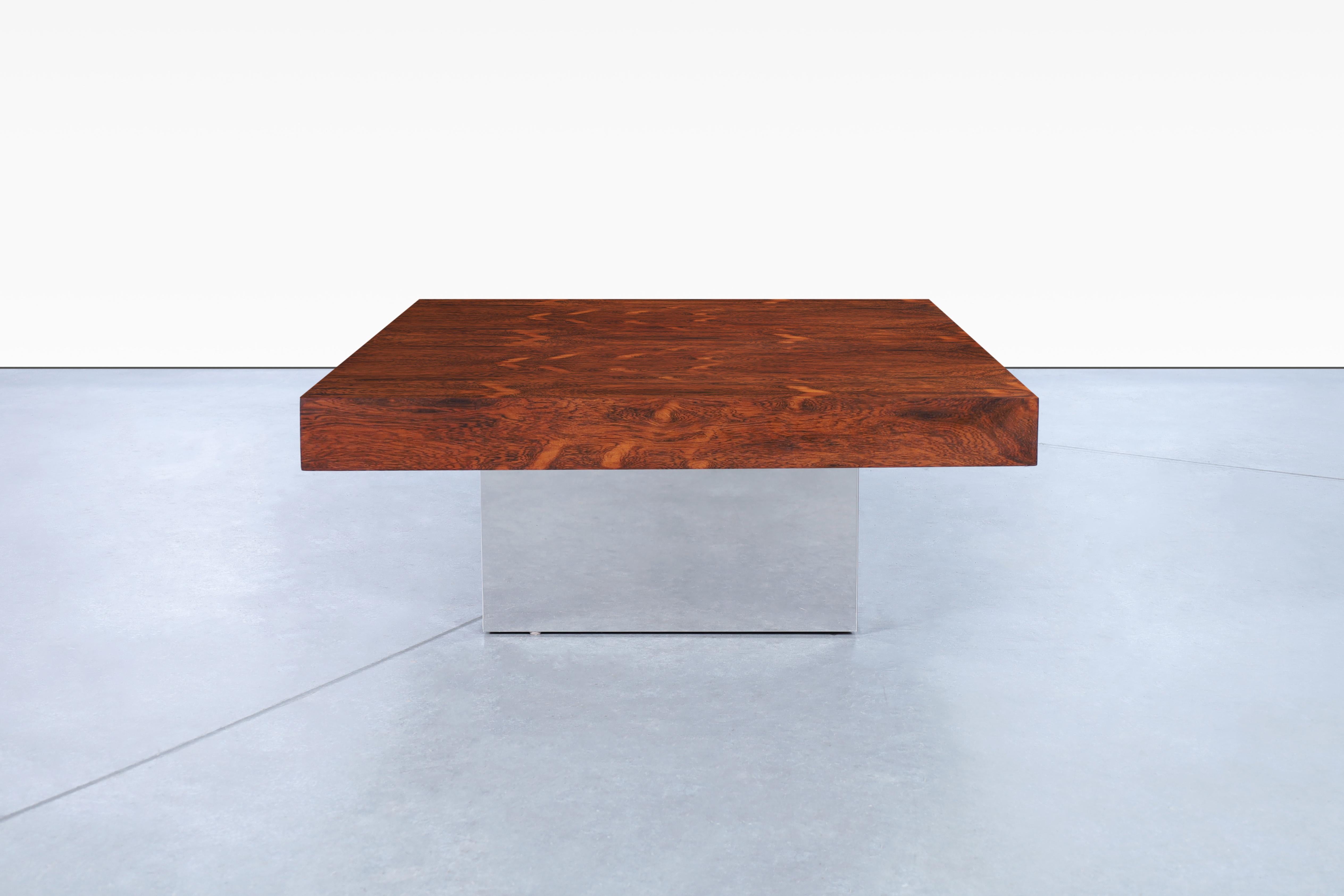 Stunning vintage rosewood and chrome coffee table designed by Milo Baughman for Thayer Coggin, in the United States circa 1970s. This table has a modern design that highlights the exceptional quality of the Brazilian rosewood used in its
