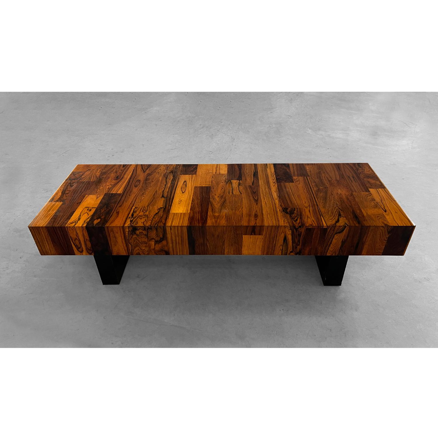 This Rosewood coffee table features beautiful rich wood grain, dual pedestal base and a smoothly sliding drawer at each end for storage. In good vintage condition with normal signs of wear. A beautiful example of 1970's furniture out of Québec,