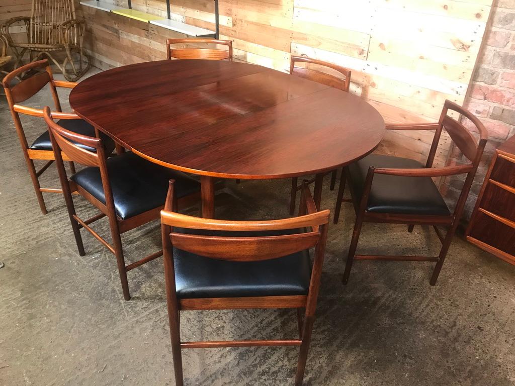 Stunning XL midcentury modern dining table from the 1960s. The table comfortably seats six (6) when extends. It features one extension leave that sits underneath the table.

Table measurements: H 74cm, D 122cm, B 122 / 168cm

A beautiful Mid-Century