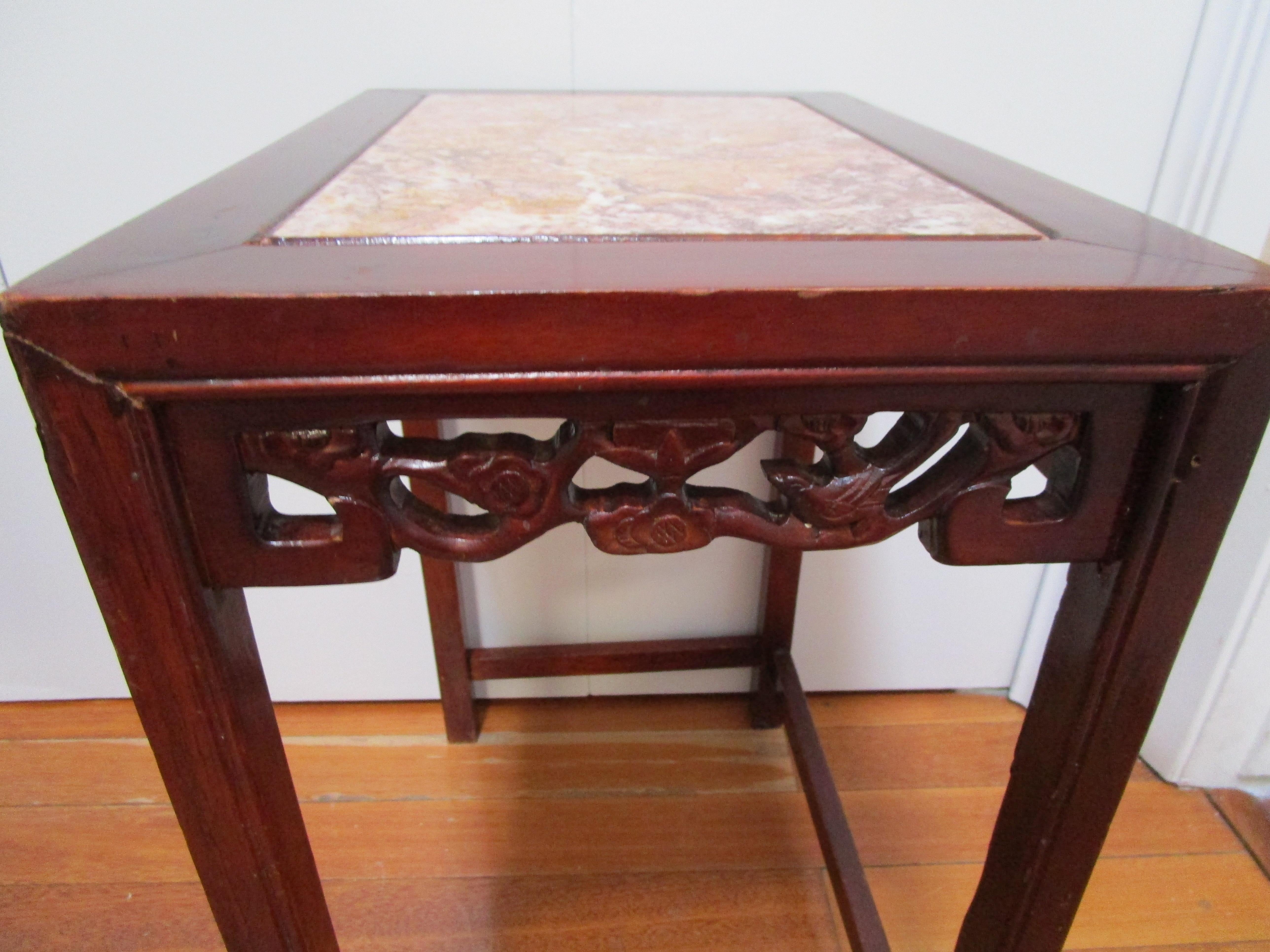 The beautiful captured top makes this table a standout. The rosewood table is also interesting for its hand-carved birds and flowers around the front, back and sides of the piece. Our appraiser says it is likely that this table became separated from