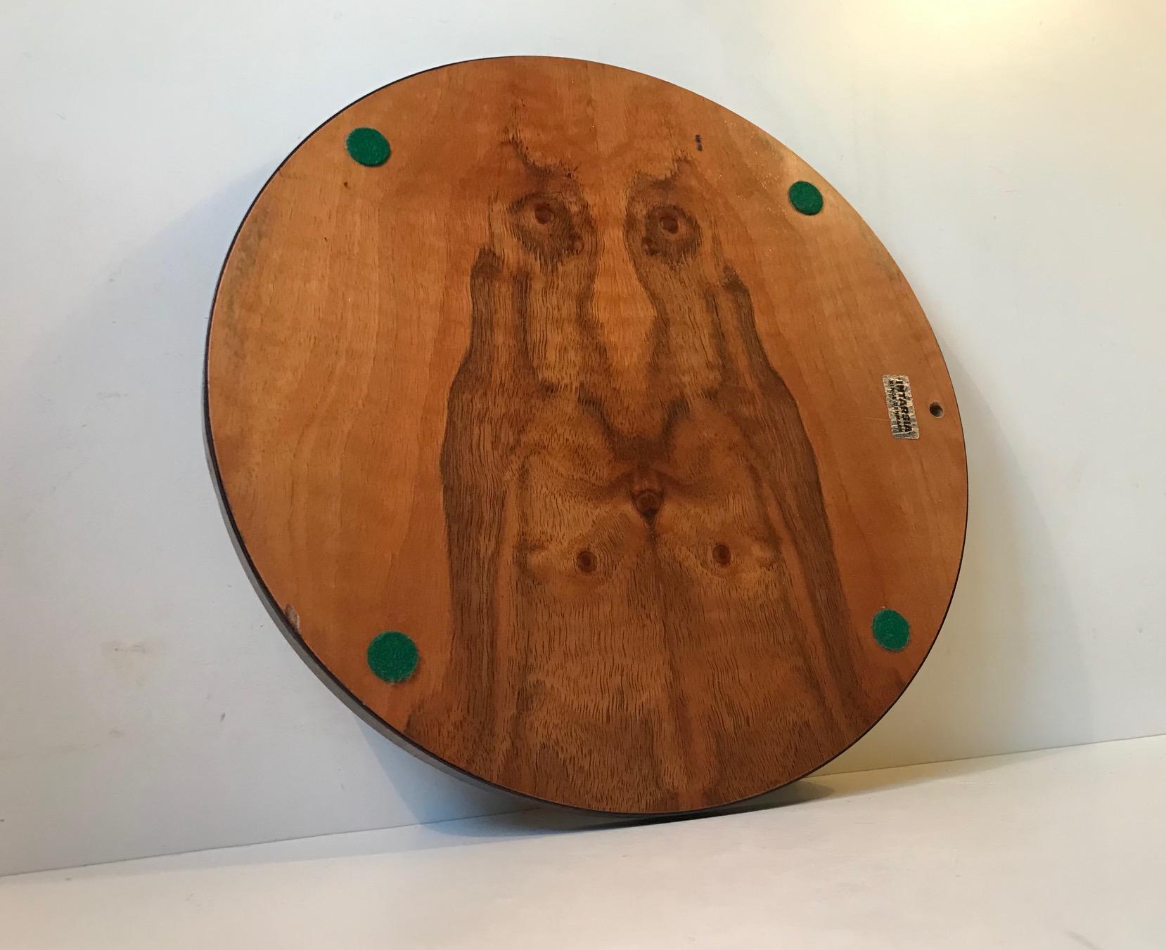 Whats unusual about this midcentury tray from Intarsia - Ringe is not so much the delicate mixed woods floral intarsia to its frontside but the balanced yet natural grain 'motif' to its backside. Whether or not it resembles Jesus or Santa Claus