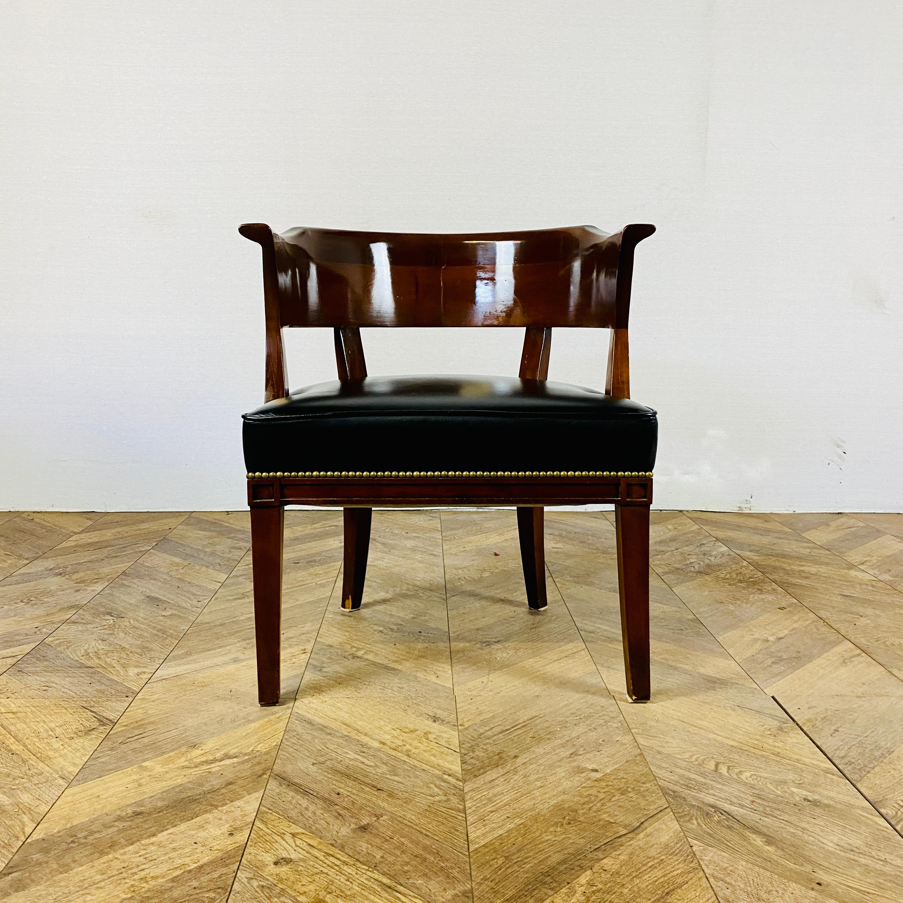 A Good Quality Rosewood & leather chair, circa 1980s.

Originally purchased from Harrods in London from new in the 1980s, the chair is super comfortable with black leather upholstery.

The chair does show small signs of wear to the frame with