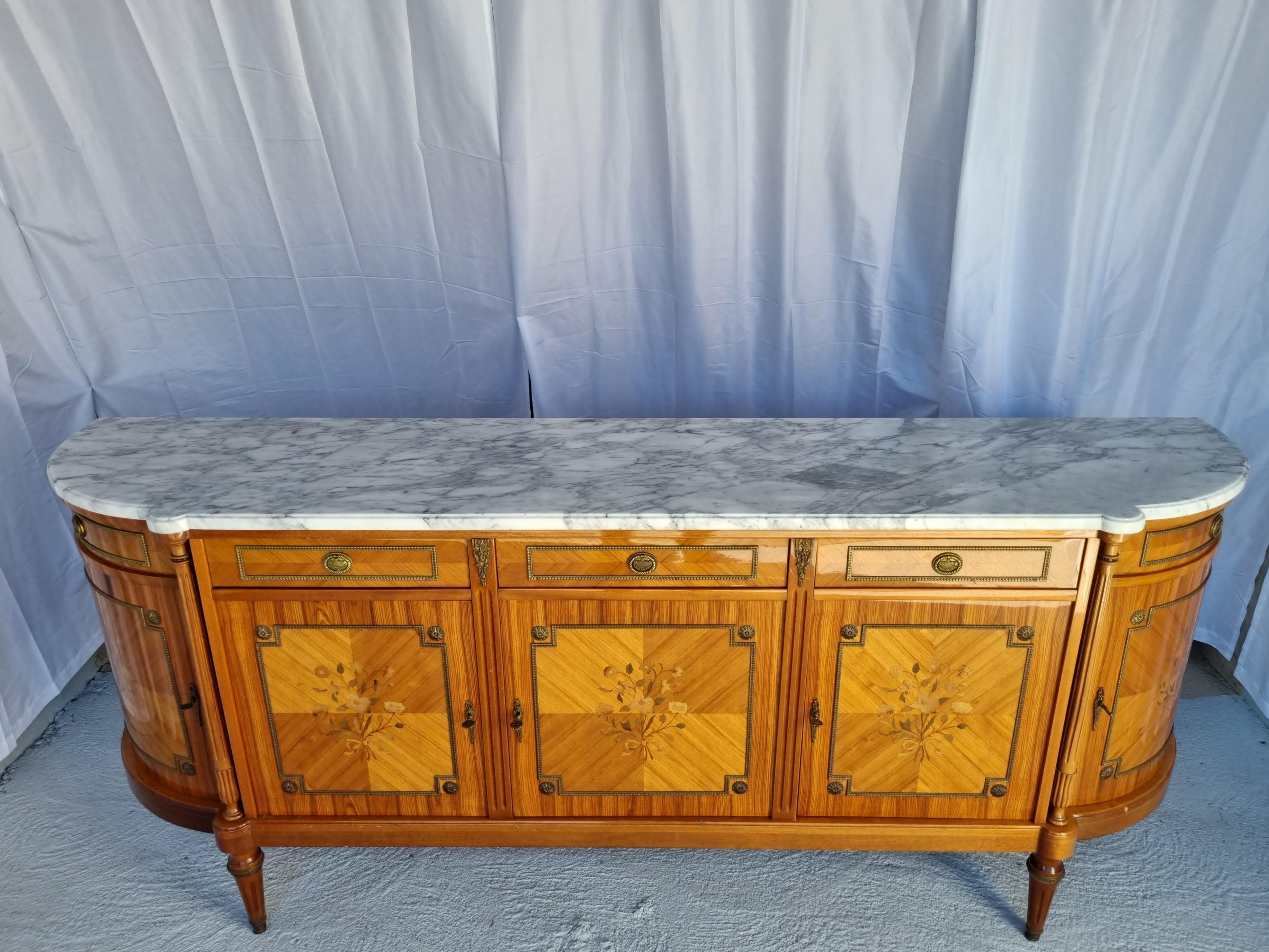 Remarkable Rosewood Sideboard with Kingwood MarquetryStyle Louis XVI/ Marie Antoniette from the 70s

Made in Paris 1976 from high quality materials - Arabescato Marble-Rosewood-Kingwood and gold Bronze.

Arabescato is certainly one of the most