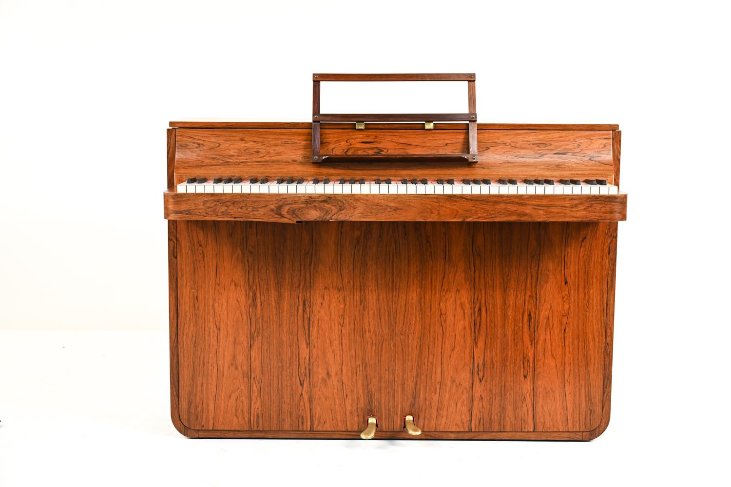A rare mid-century Danish piano, made of beautiful rosewood. It is called a pianette because of its 82 keys rather than the standard 88 keys of a full-size piano. This piano is made by the famous piano maker Louis Zwicki. Every piano by Louis Zwicki