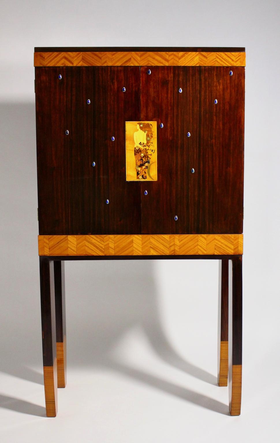 The extraordinary vintage secretary/cabinet in the style of Koloman Moser, Carl Otto Czeschka and Portois & Fix is a top quality furniture piece, which was designed and made in the 20th century in Vienna.

The secretary was made of spruce and shows