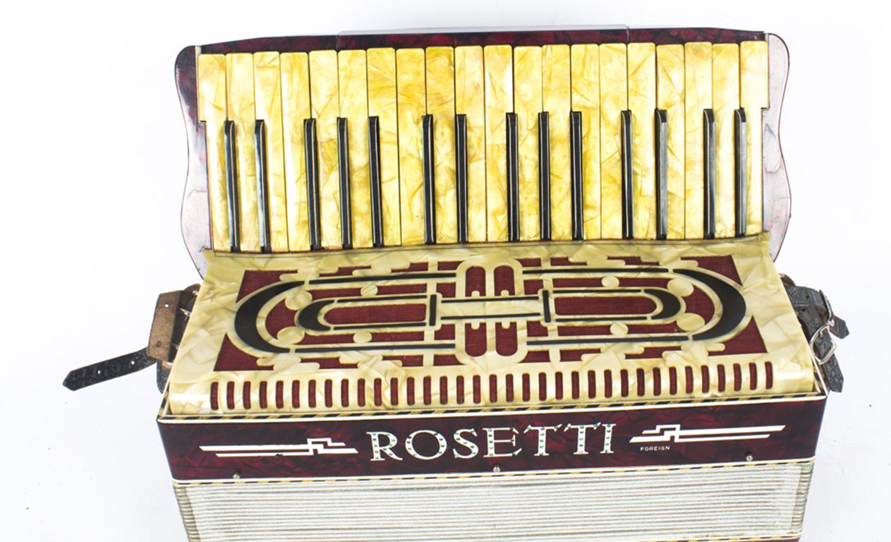This is a lovely vintage highly decorative red pearl finish piano accordion by Rosetti.

Complete with old travelling case.
 
Condition:
A superb decorative item.

Dimensions in cm:
Height 38 x Width 42 x Depth 24 - with case

Dimensions in