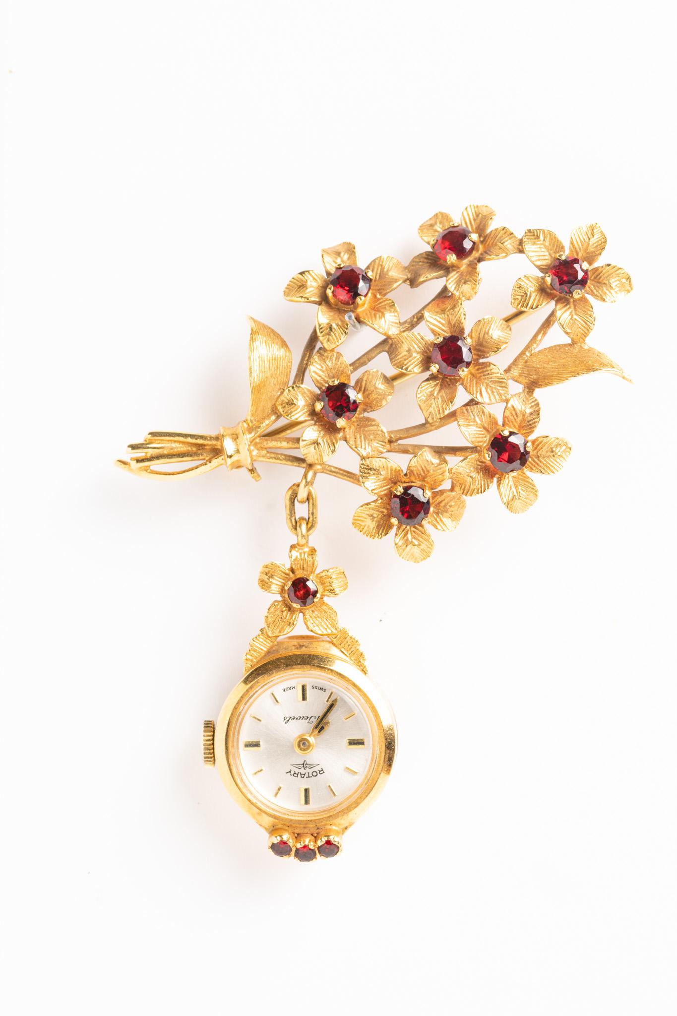 Beautiful and unique vintage Rotary 9ct Gold Watch Floral Brooch. The watch is made circa 1968 by an award-winning worldwide brand of classic timepieces. This Rotary watch brooch has manual wind 21 jewelled Swiss movement. The face is oval with a