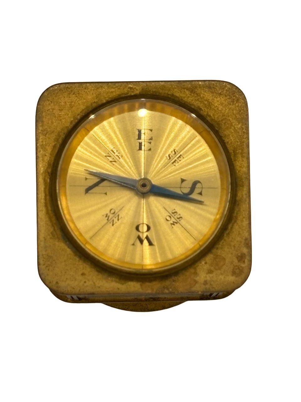 Solid brass Art Deco era desk clock with 8 days movement, with a thermometer, barometer, hygrometer, and compass (in both Celsius and Fahrenheit) by the Angelus Meteo Watch Company

Circa 1930s, by Angelus Meteo, Switzerland


This unique clock and