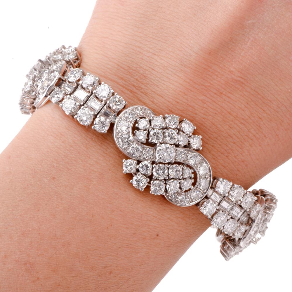 This dazzling vintage link bracelet of unsurpassed elegance and sophisticated aesthetic is crafted in solid platinum, weighs 69.7 grams and measures 7 inches long and 21mm maximum width. The bracelet incorporates 4 meticulously designed ribbon-bow