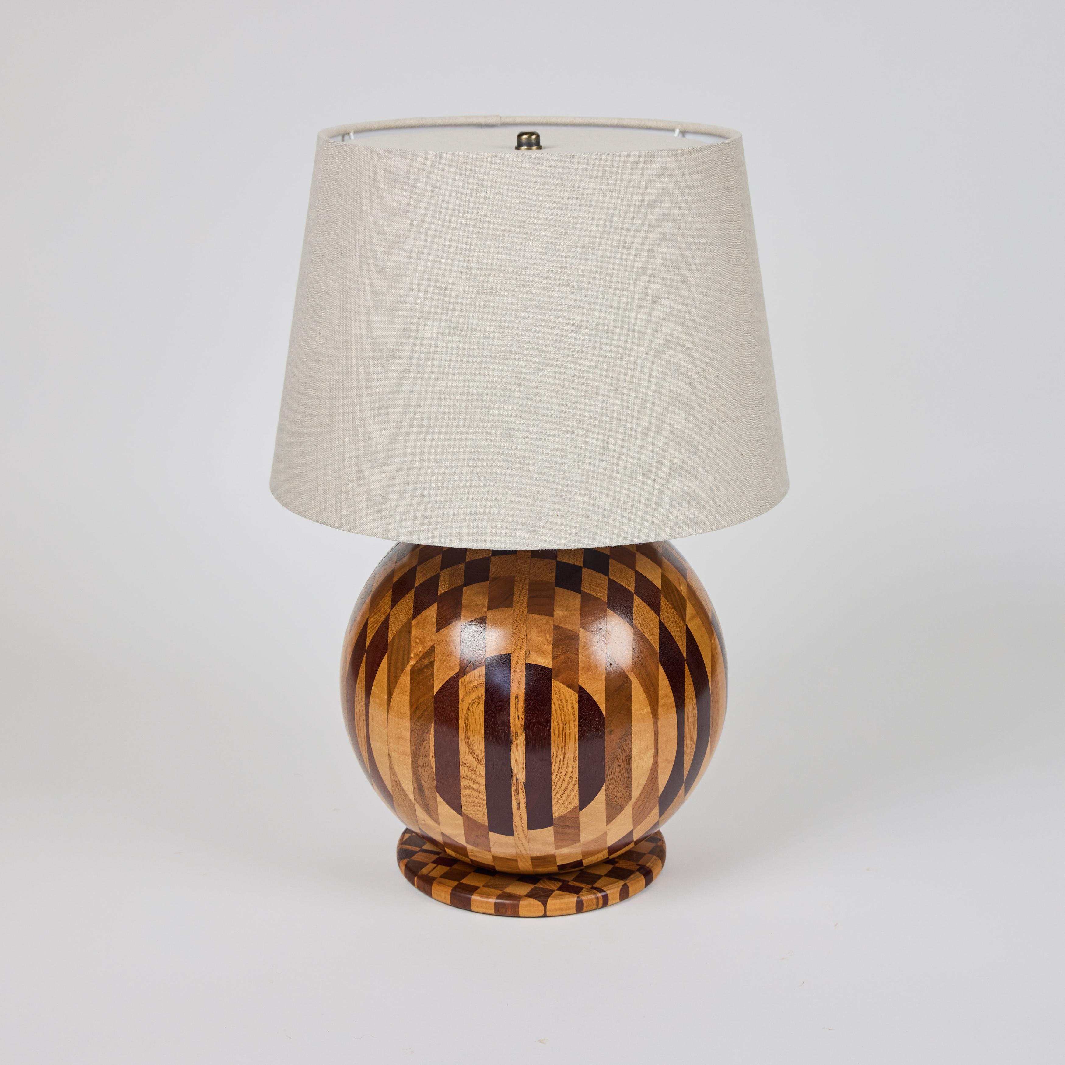 Vintage round ball marquetry wood lamp on base. Newly wired with custom linen shade.

14