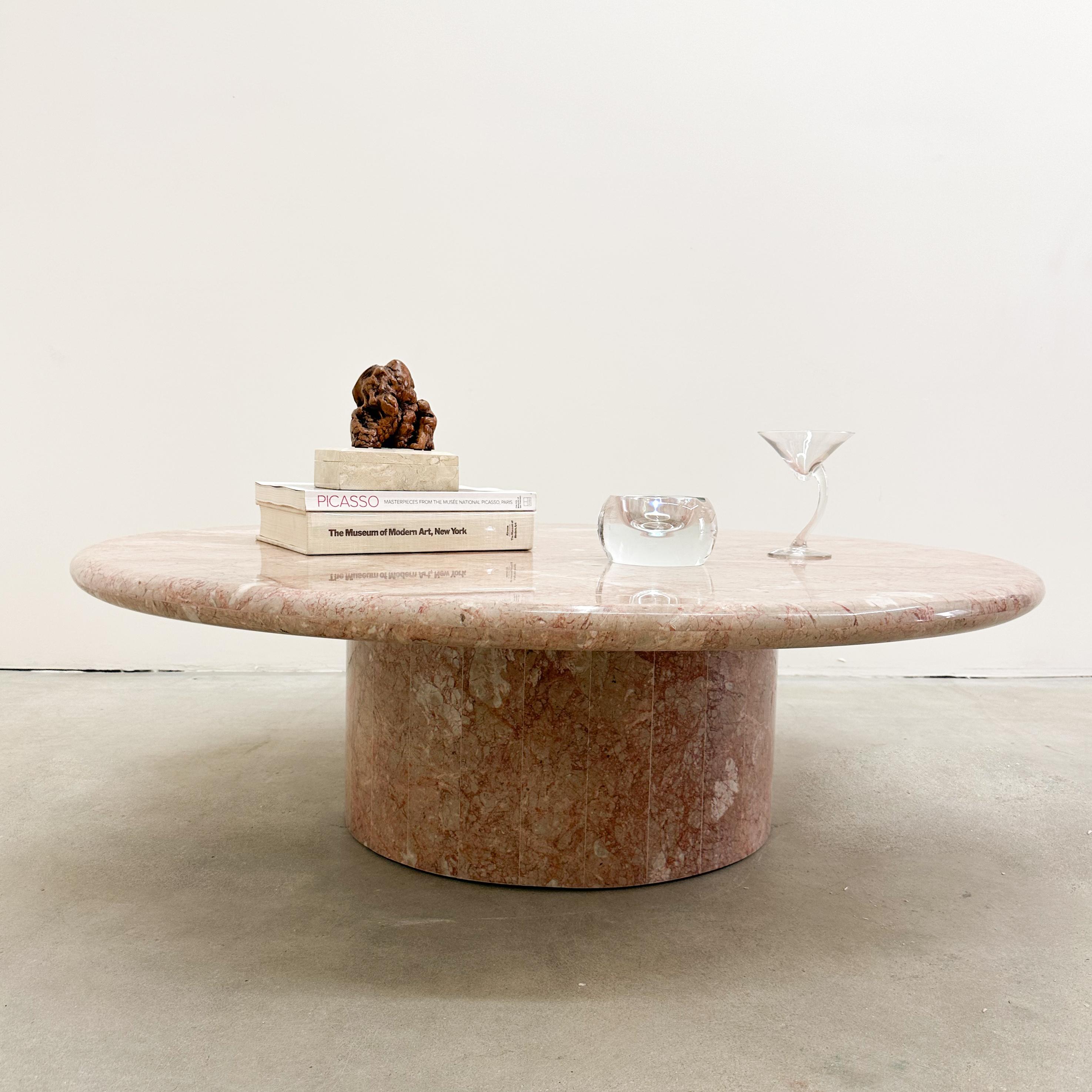 Vintage Breccia Pernice coffee table. I believe the table is made from Breccia Pernice marble, featuring shades of pink with streaks of strawberry throughout. While I am not entirely certain, my research indicates that it is most likely Breccia
