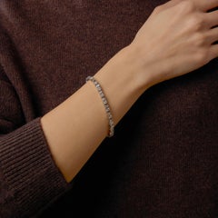 Vintage round brilliant and baguette cut diamond 18k white gold tennis bracelet