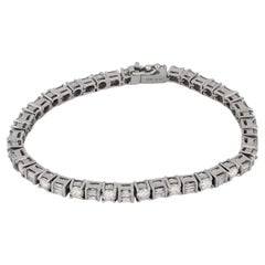 Vintage round brilliant and baguette cut diamond 18k white gold tennis bracelet