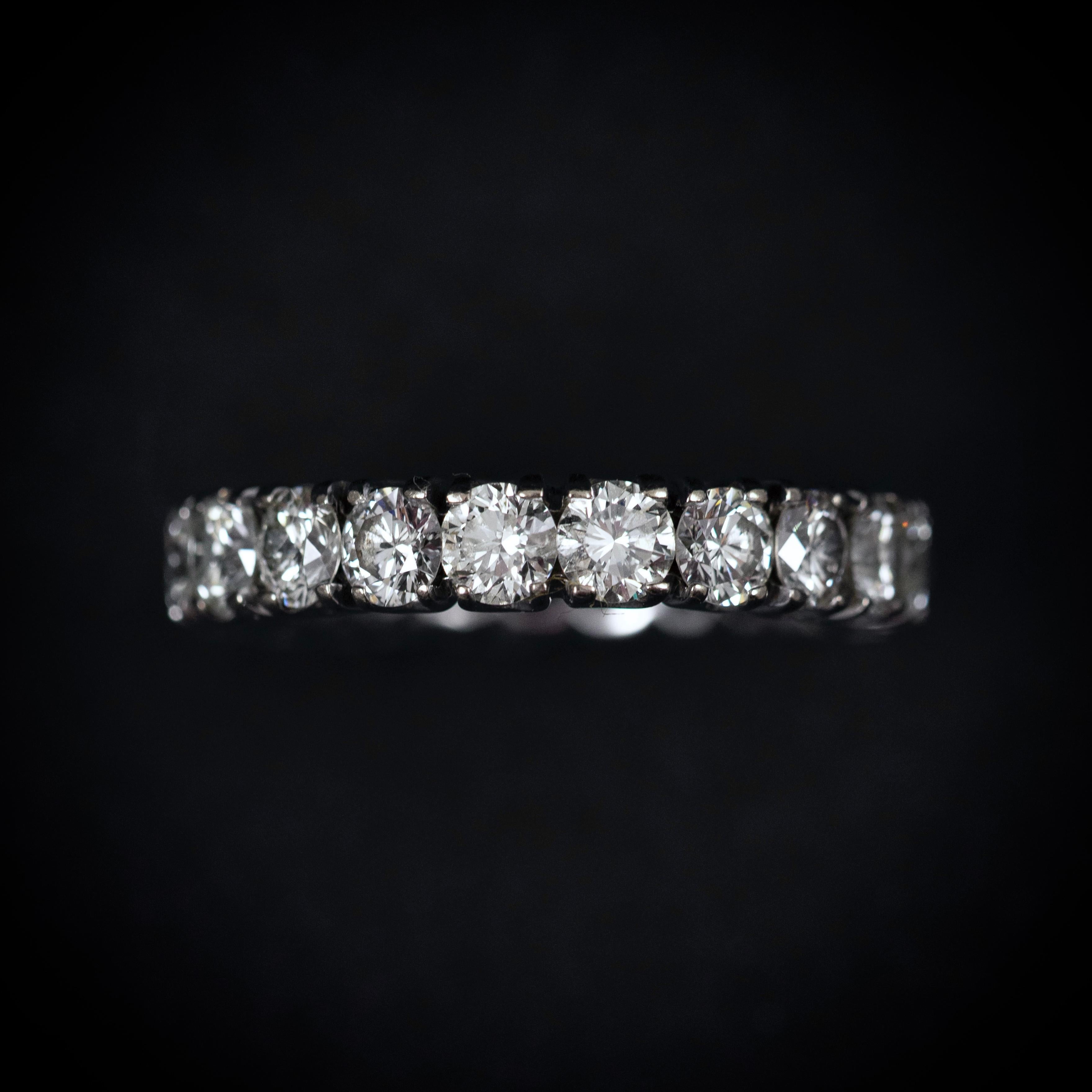 Vintage diamond full eternity ring in 14kt white gold, late 20th century. A timeless symbol of enduring love, this vintage full eternity ring showcases 20 scintillating round brilliant-cut diamonds in an unbroken circle of light. Crafted in 14k