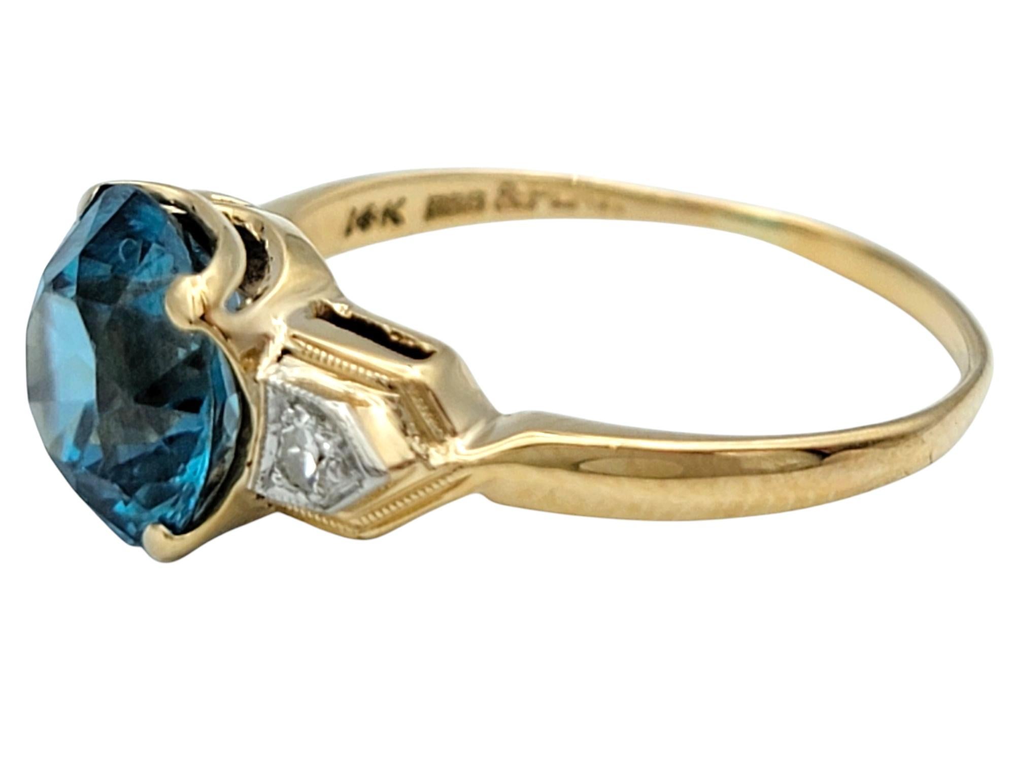 Women's Vintage Round Cut Blue Zircon and Diamond Three-Stone Ring 14 Karat Yellow Gold For Sale