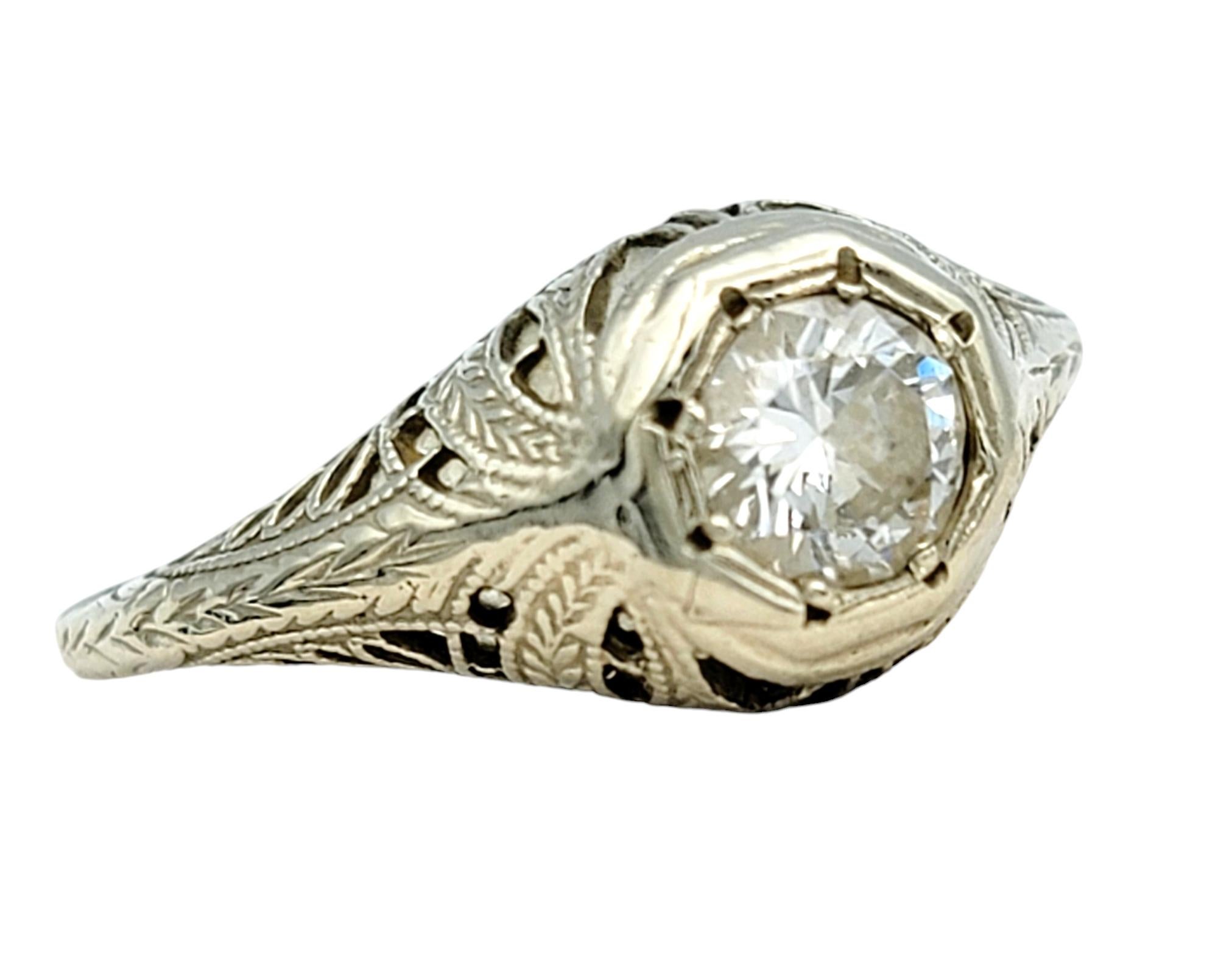 Ring size: 5.5

Experience the sophistication and elegance of this incredible vintage diamond solitaire ring. This stunning piece features a single round-cut diamond, radiating brilliance and fire, and beautifully set in an intricate 14 karat white
