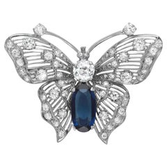 Spilla a farfalla vintage con diamante rotondo e zaffiro blu sintetico in oro bianco 14 carati