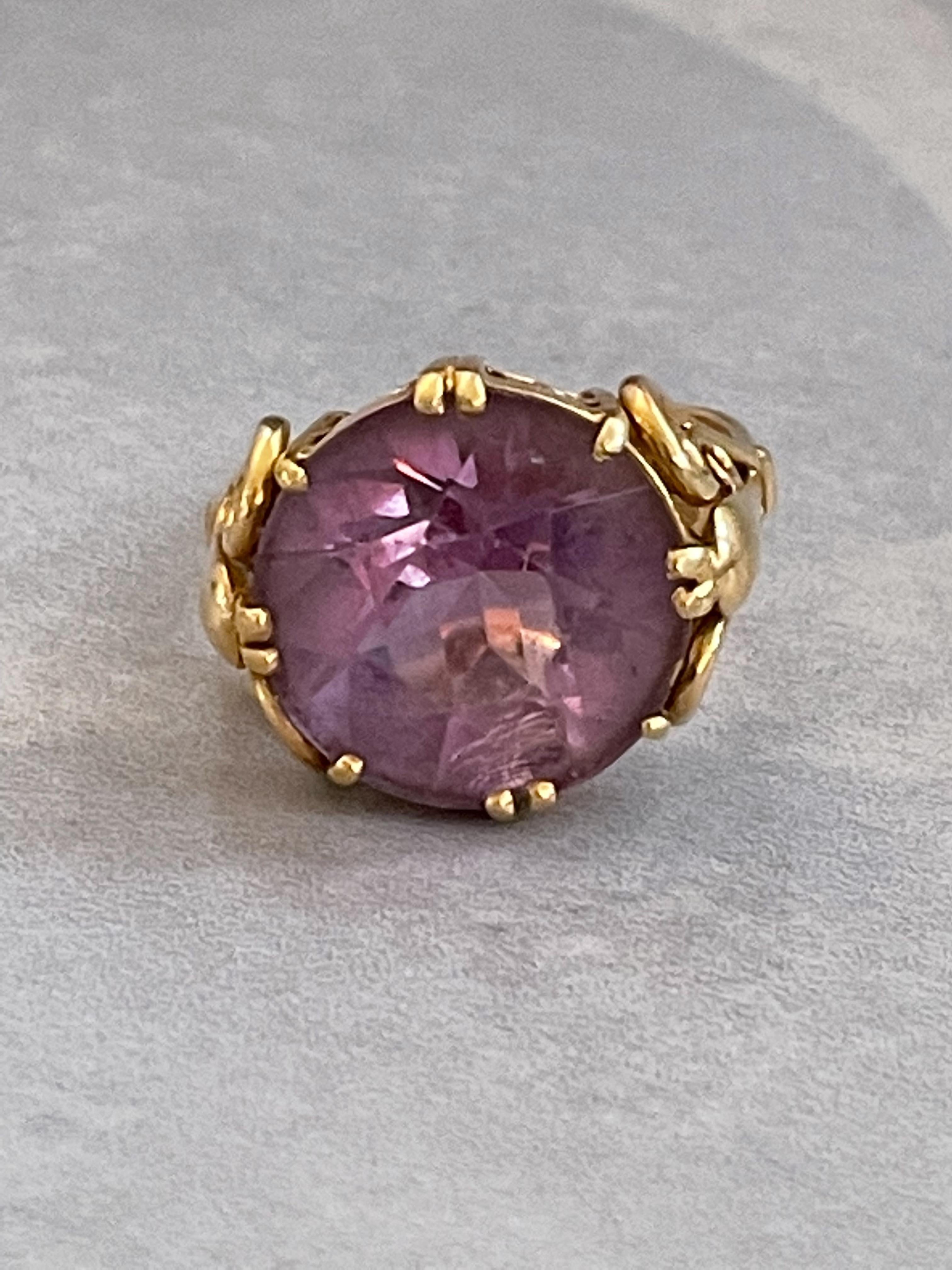 The setting is as beautiful as the stone in this vintage ring.  It's handmade and one-of-a-kind which his the beauty of vintage jewelry.  No one else has a ring like this one!

This ring features a round, faceted Amethyst.  The diameter of the stone