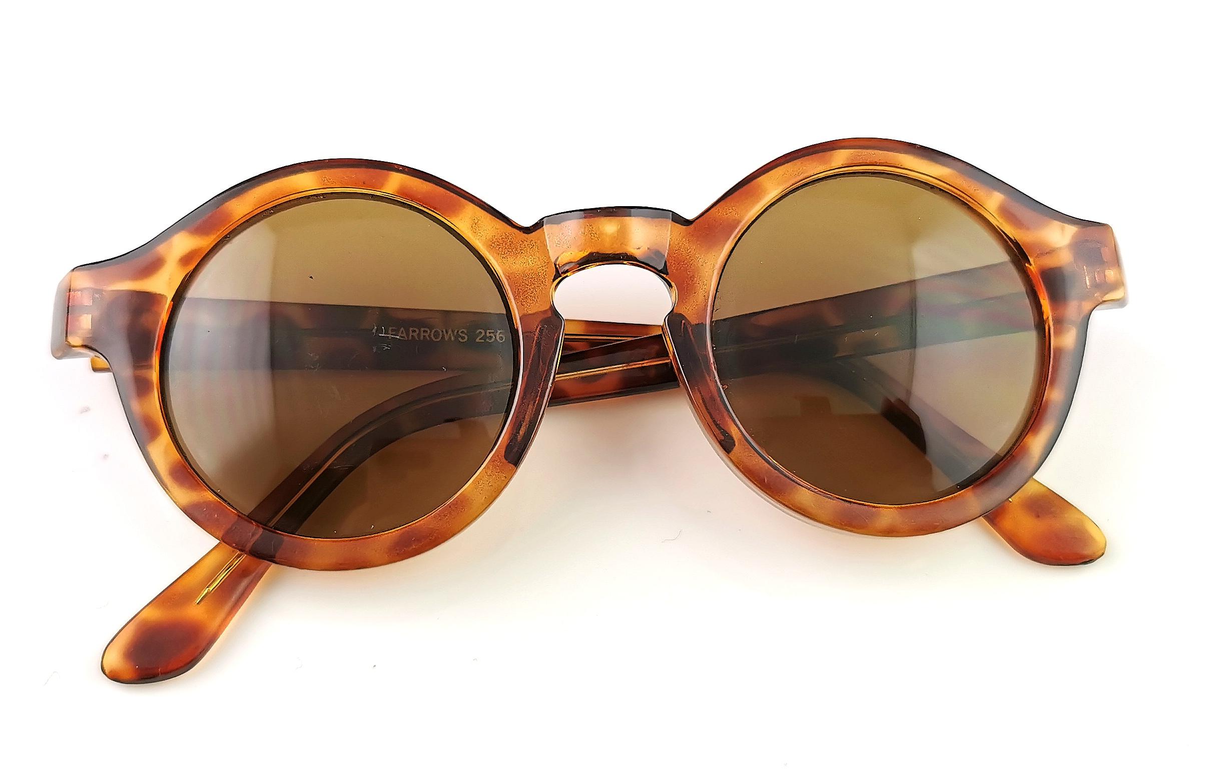 A fab pair of vintage retro style round framed sunglasses in a faux tortoiseshell acetate by Linda Farrow.

They are a lovely chunky pair of sunglasses, marked on the arm Farrow.

They have black tinted lenses.

These do not come with a case but