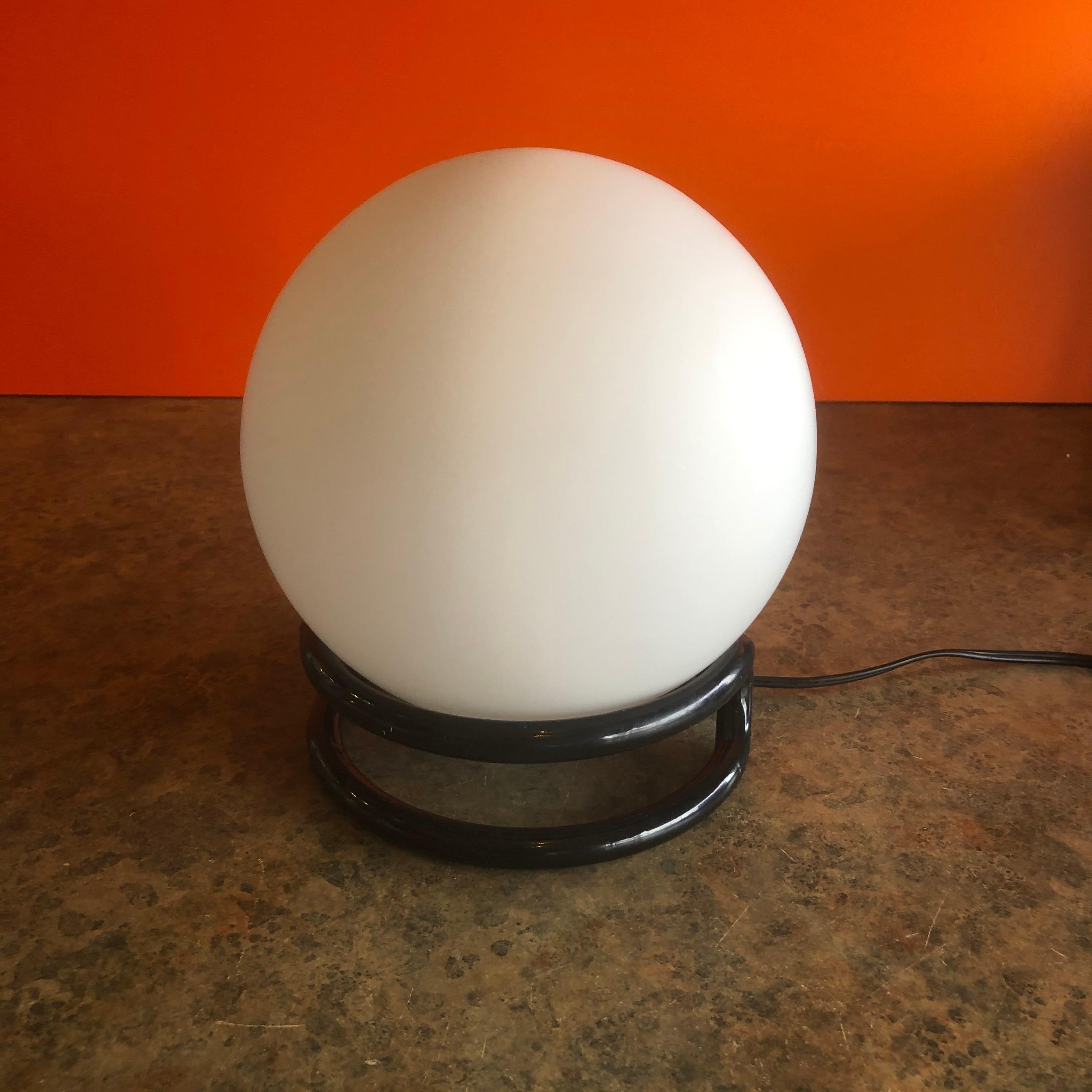 Vintage round white glass globe table lamp on base, circa 1970s. The piece is in very good condition and measures 7.5