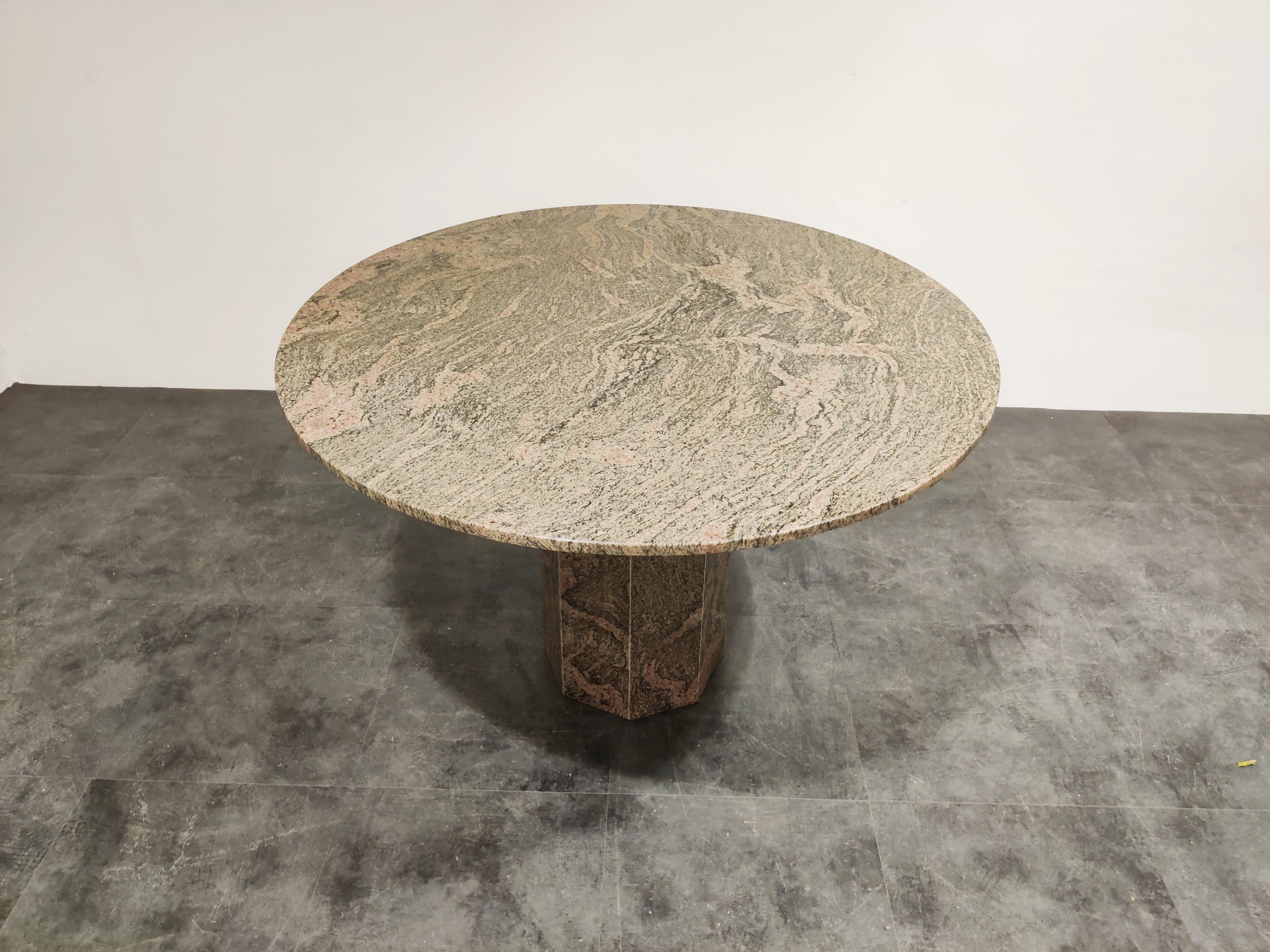 Vintage granite dining table 

Beautiful round tabletop resting on an octogonal base.

Good condition.

1970s, Belgium

Measures: Height 73cm/28.74