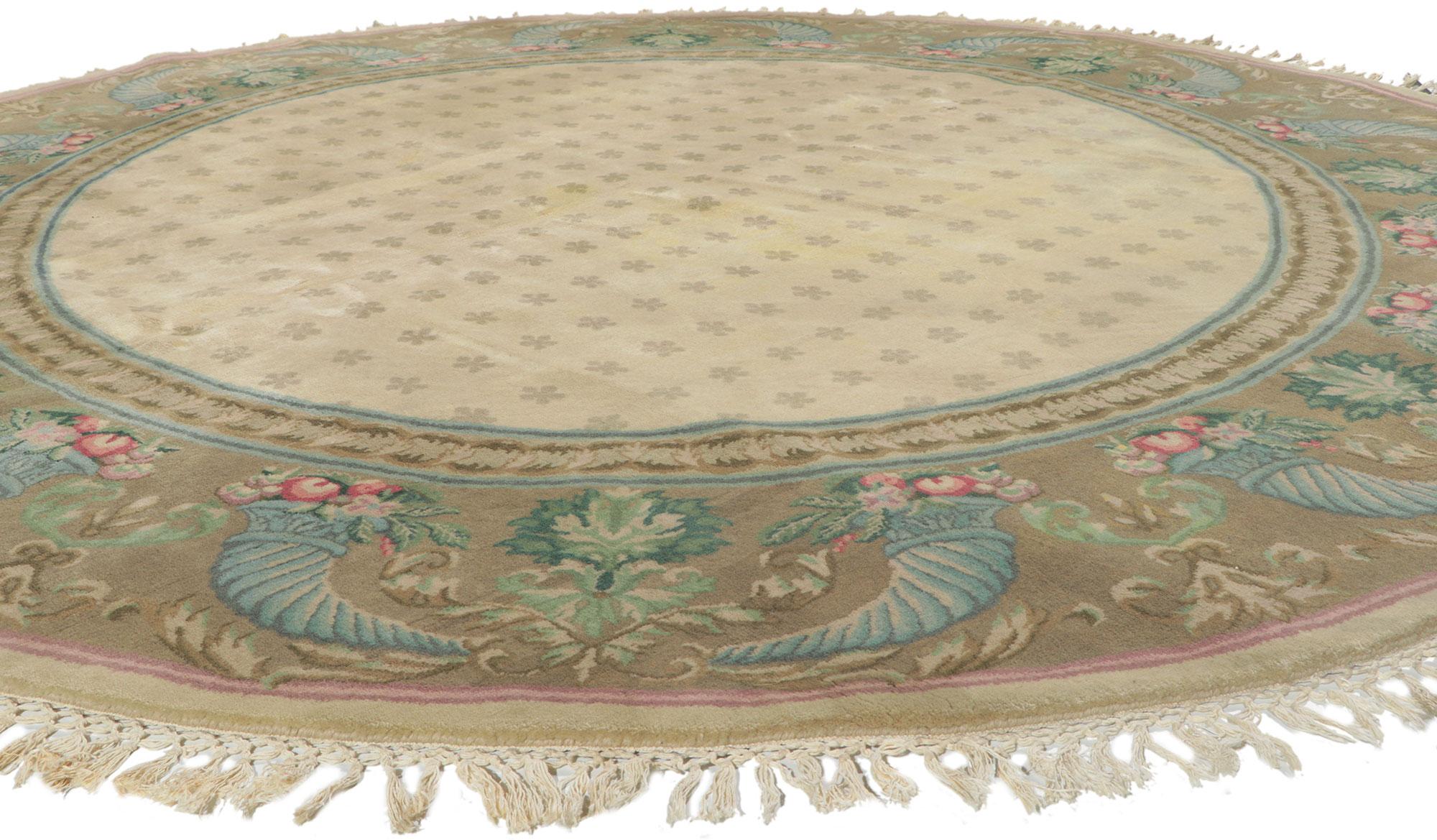 74754 Vintage Round Indian rug with Traditional Style 08'02 x 08'02. This hand-knotted wool vintage round Indian rug features a traditional style composed of a repeating geometric pattern. It is enclosed with a timeless cornucopia border. The
