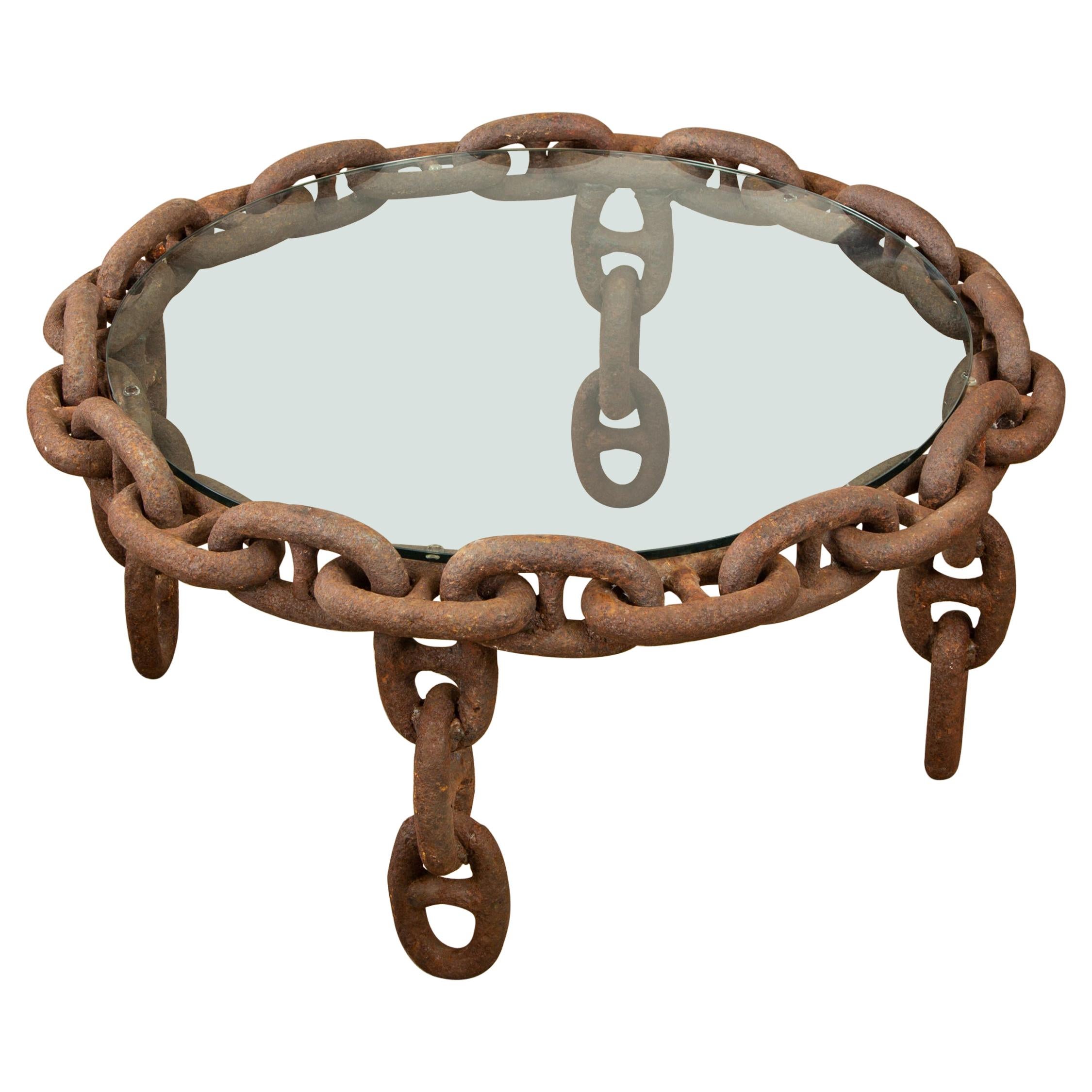 https://a.1stdibscdn.com/vintage-round-iron-chain-link-glass-coffee-table-for-sale/1121189/f_172143221576310493364/17214322_master.jpg