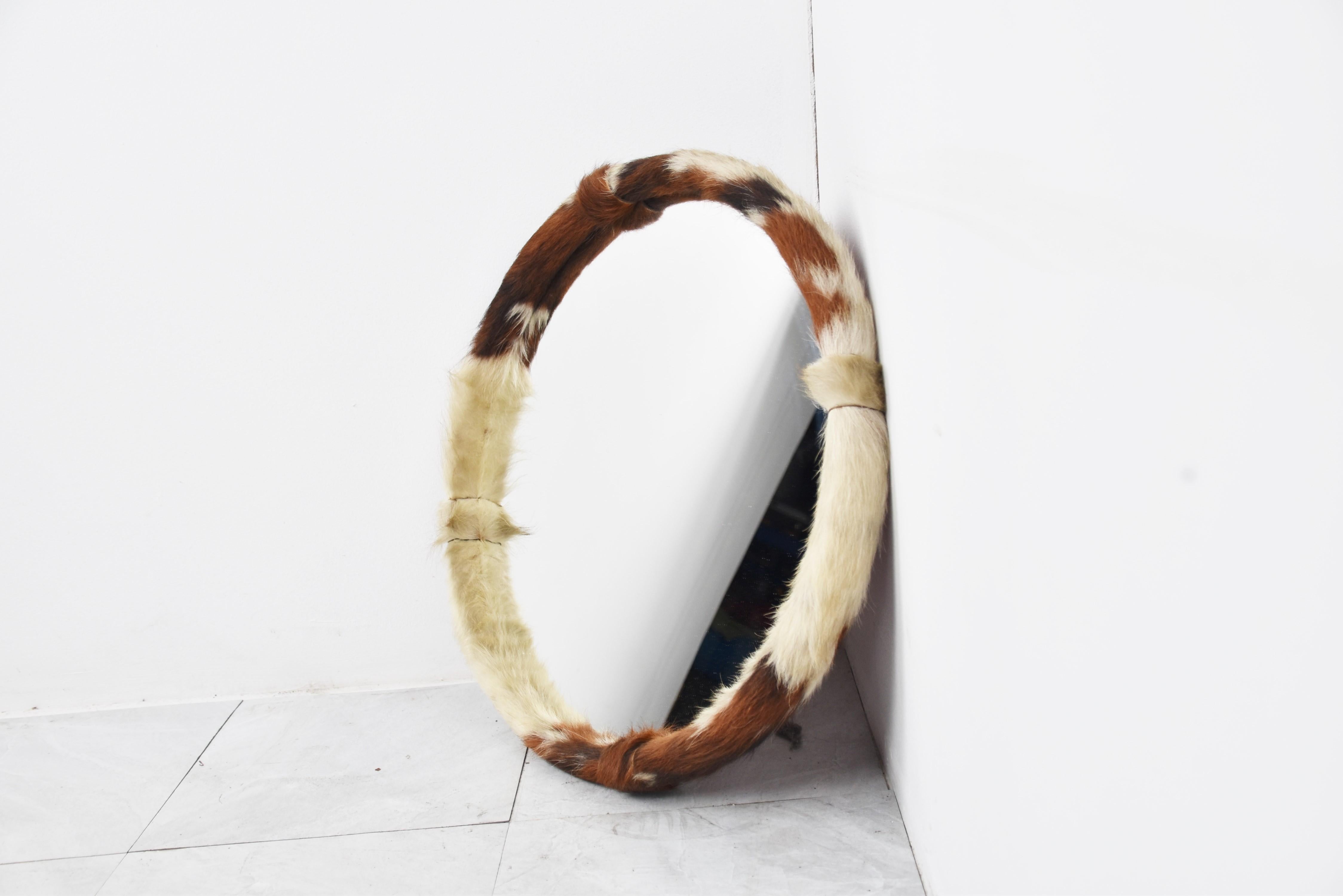 Cool 1970s mirror with fur.

A nice eye catching mirror

1970s - Belgium

Dimensions:
Diameter: 52cm/20.47