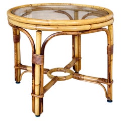 Tavolino rotondo vintage in rattan con piano in vetro su misura