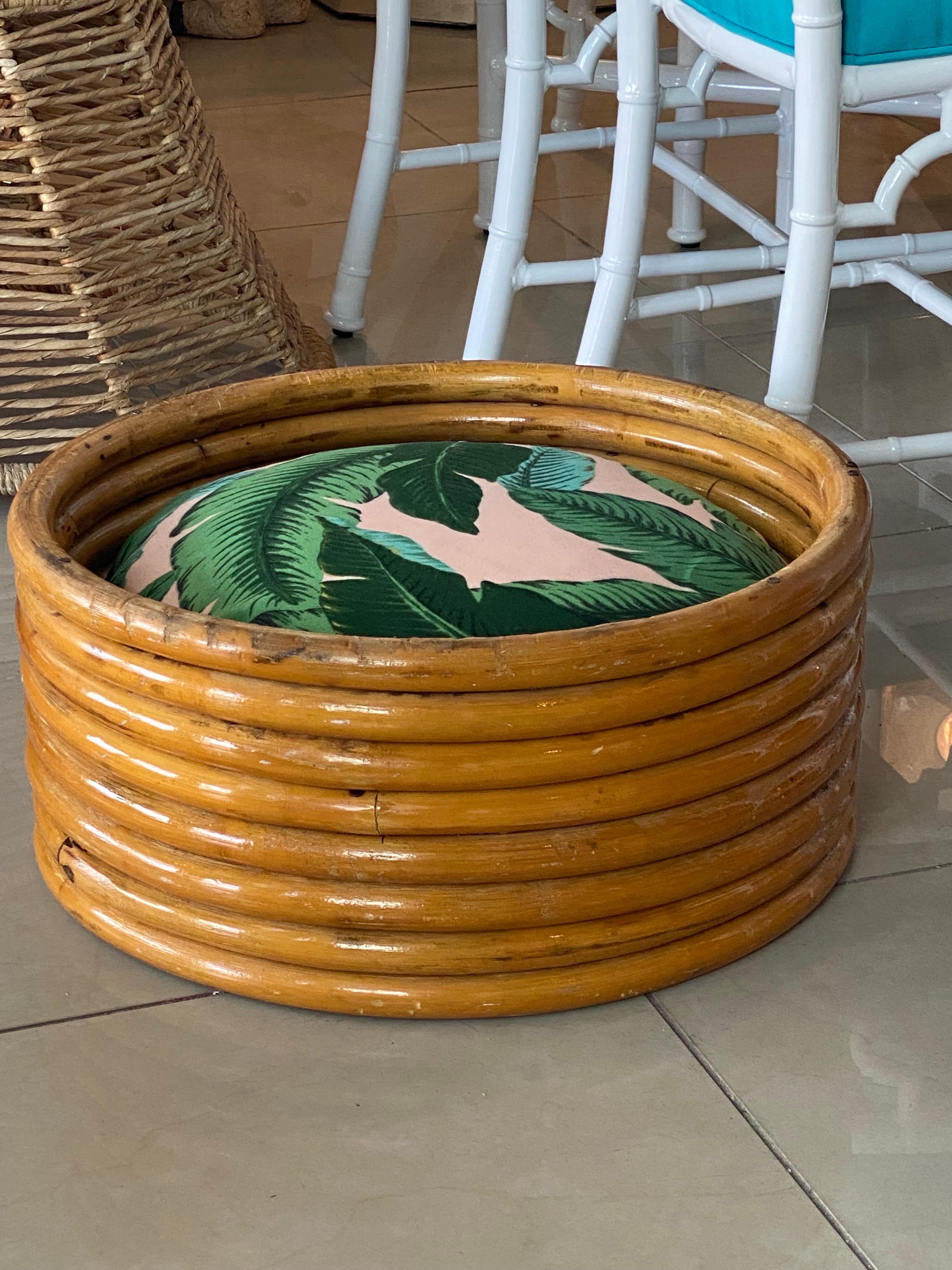 Beautiful vintage round rattan dog bed. Cushion has been custom made and is removable, washable with zippered cover for easy washing. Upholstery is outdoor fabric for durability.