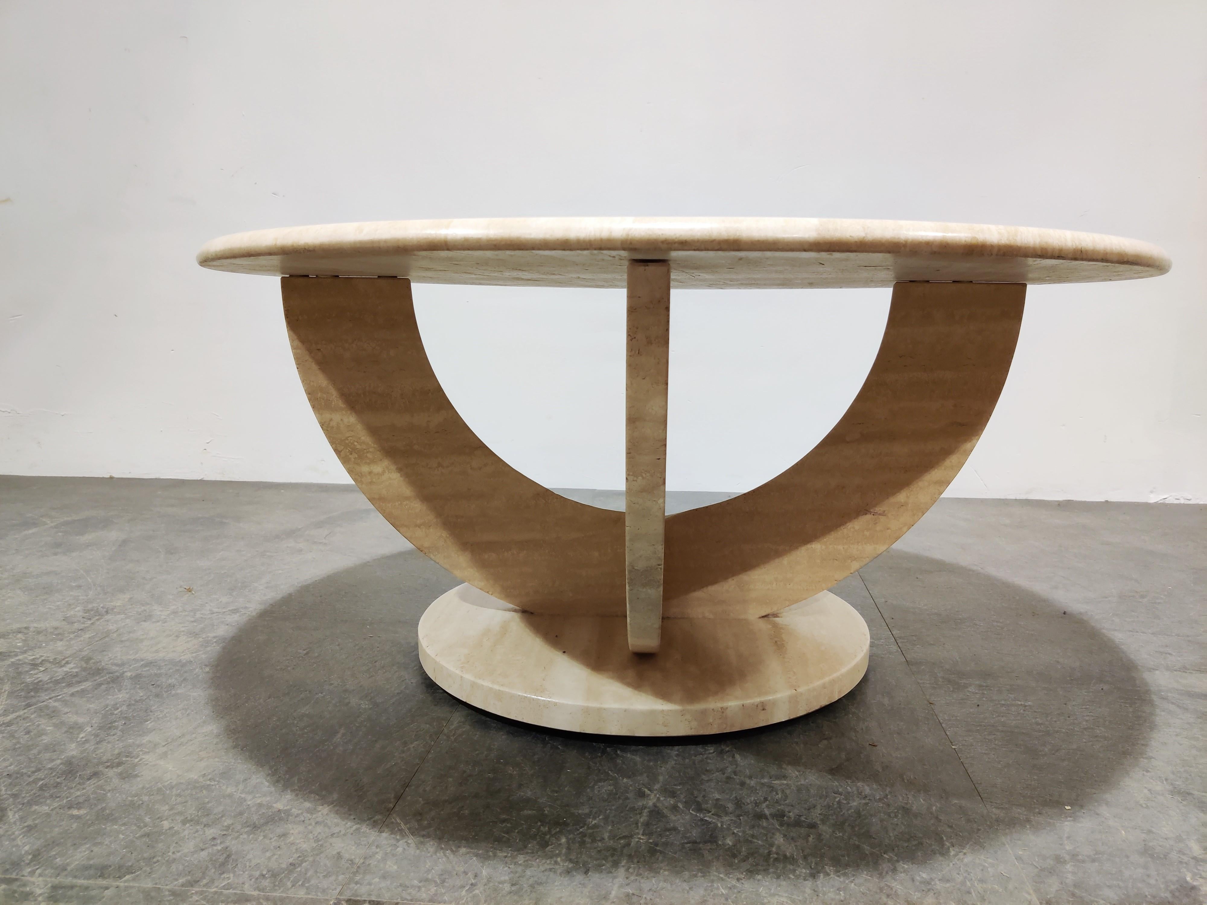 Vintage round travertine coffee table with a nicely shaped base.

The round top has been nicely finished. 

Good condition.

1970s, Italy

Dimensions:
Height 43cm/16.92