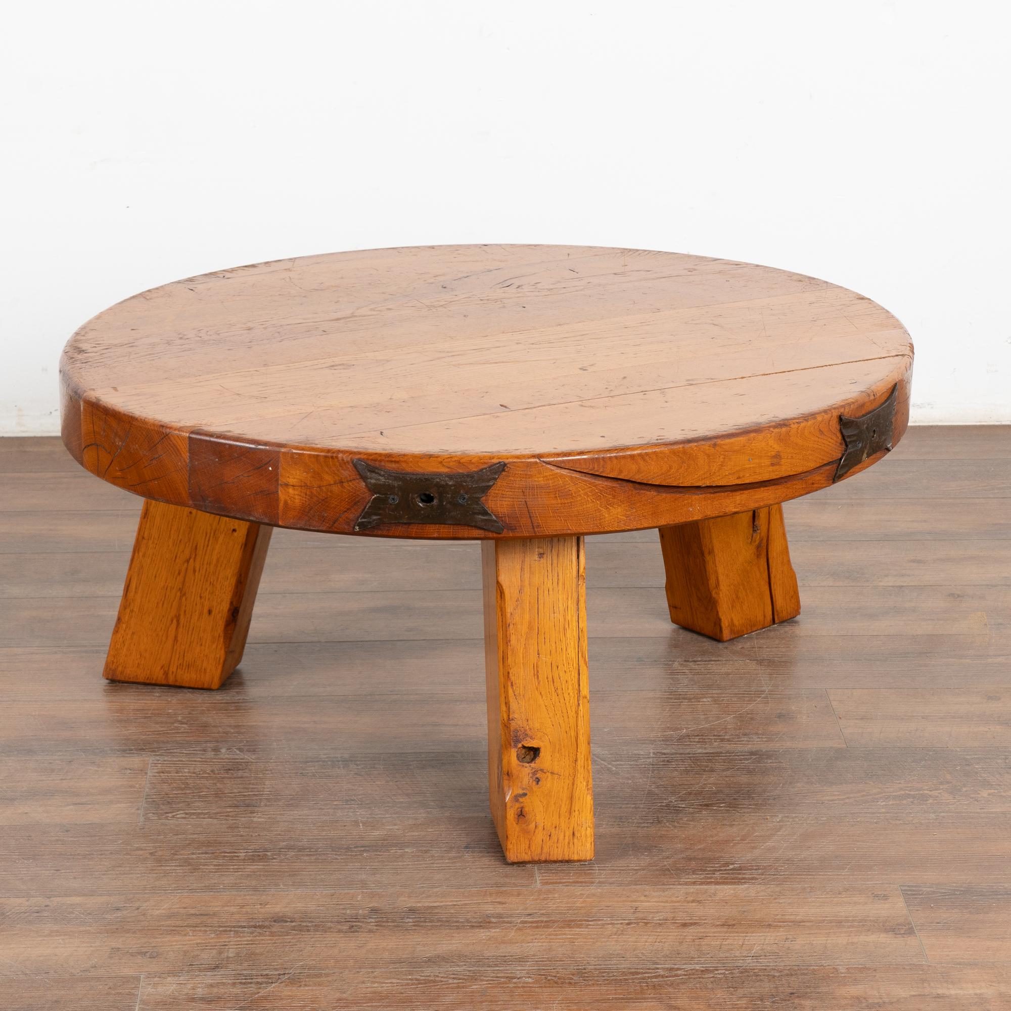 The appeal of this heavy French oak coffee table comes from the rich patina of the wood. Every crack, ding, old knot and stain all add to the depth and richness found in the thick 3.25