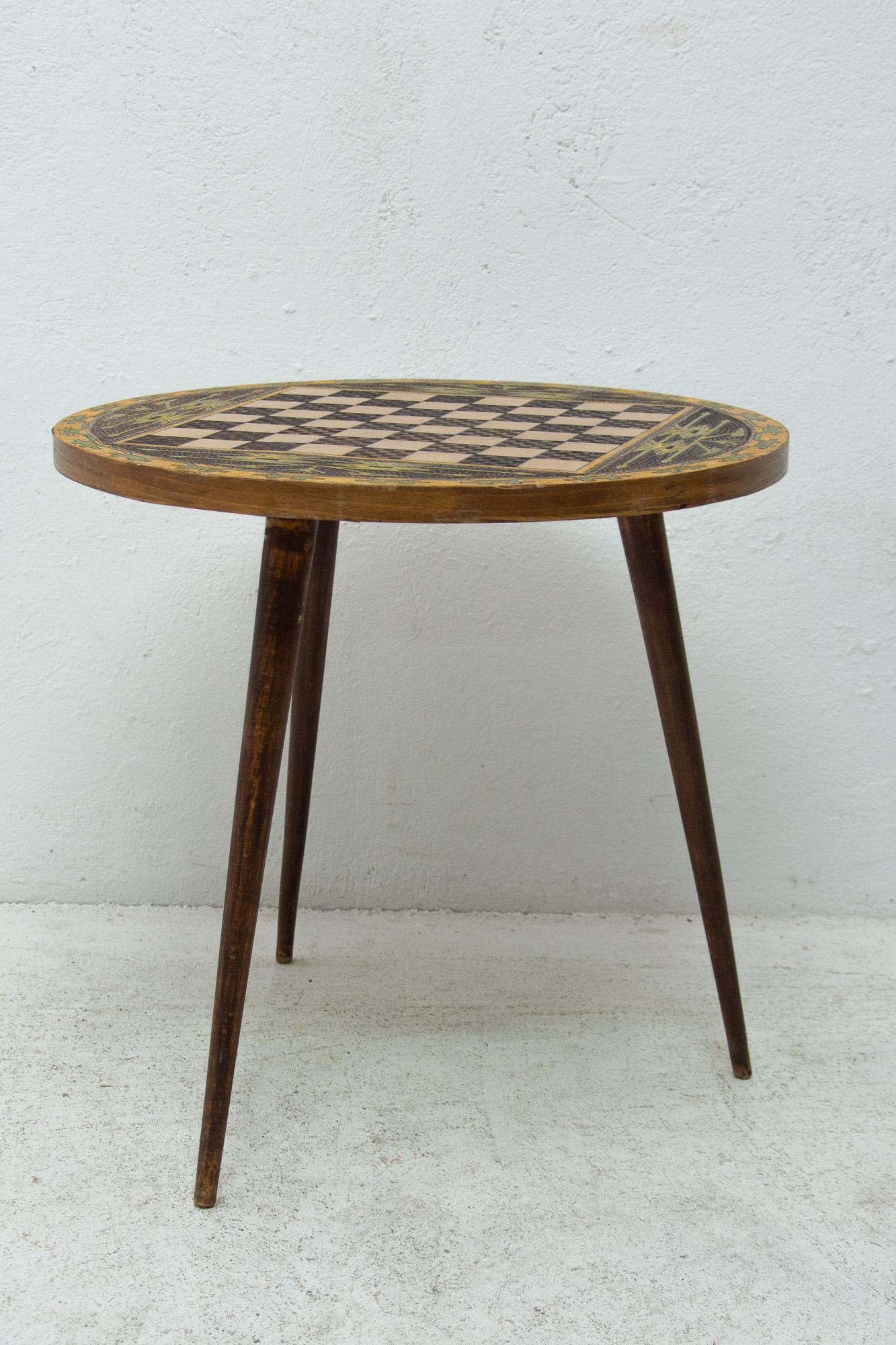 This vintage side table was made in Albania in the 1970s. It´s made of wood and has a chess pattern on the board. Cool retro piece. In good Vintage condition, the surface shows signs of age and using.