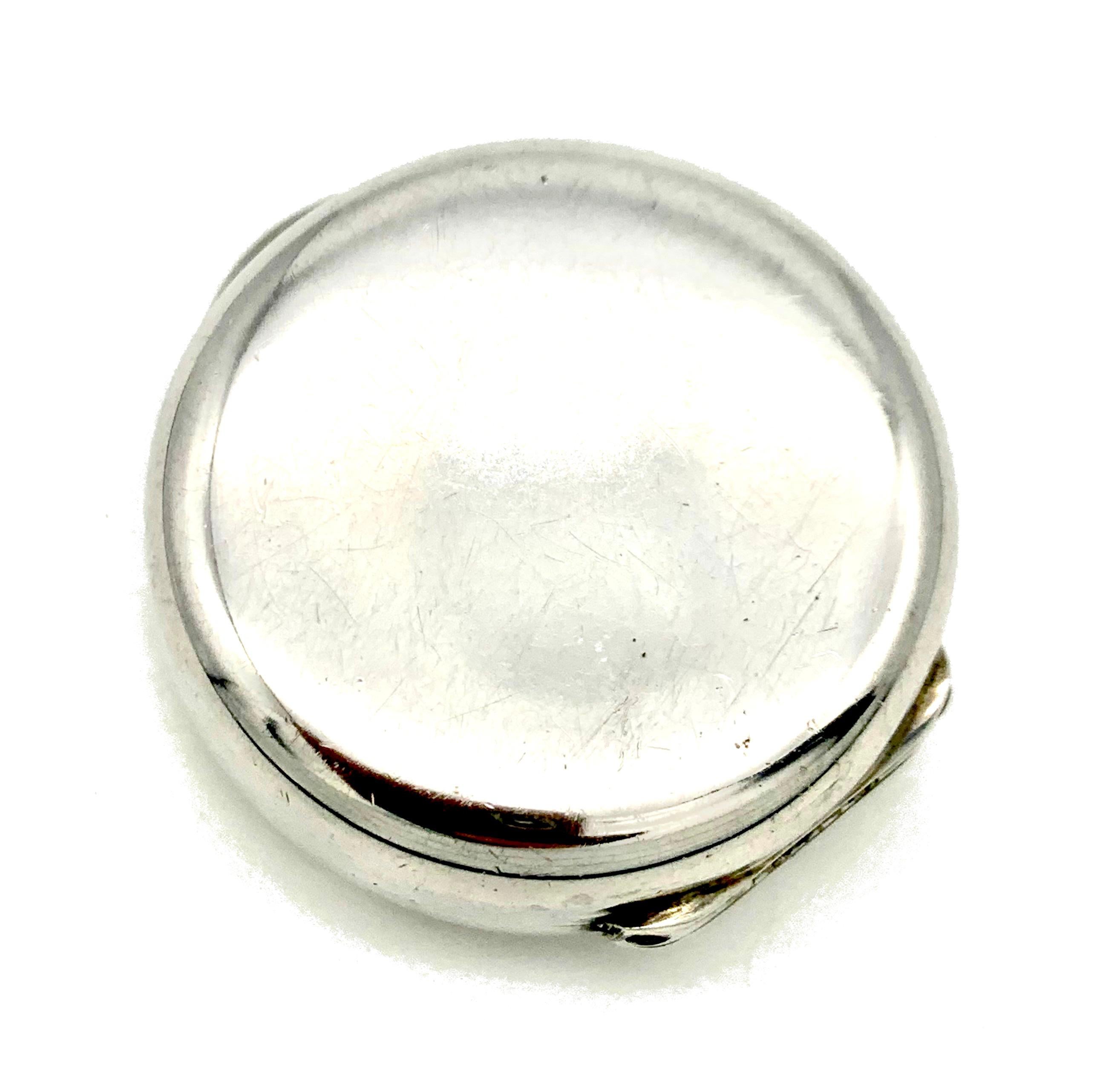 This elegant plain round silver pillbox is stamped 800.  It is accompanied by an Italian stamp in use since the mid 1930's. The box has been in use and has some very light superficial scratches but no dents.  