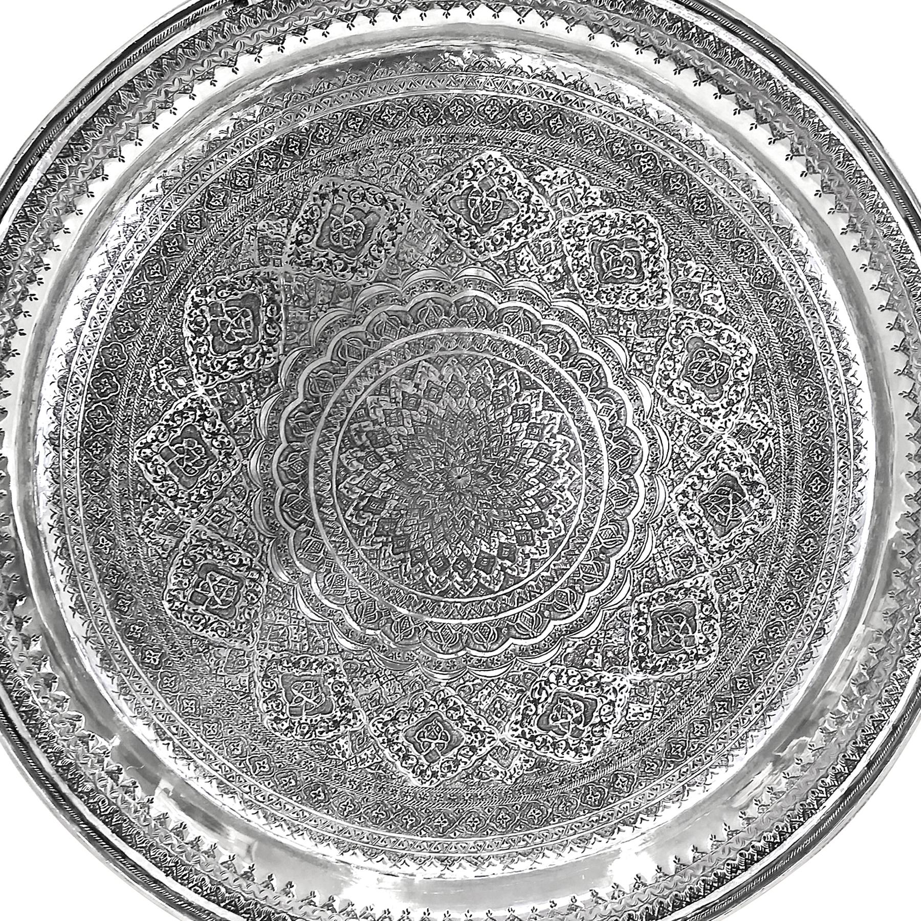 Old round silver tray. 
.900 karat silver. Very detailed and delicate hand carved. 
Designer: josdani
Weight: 1564 grams
Diameter= 16 inches
