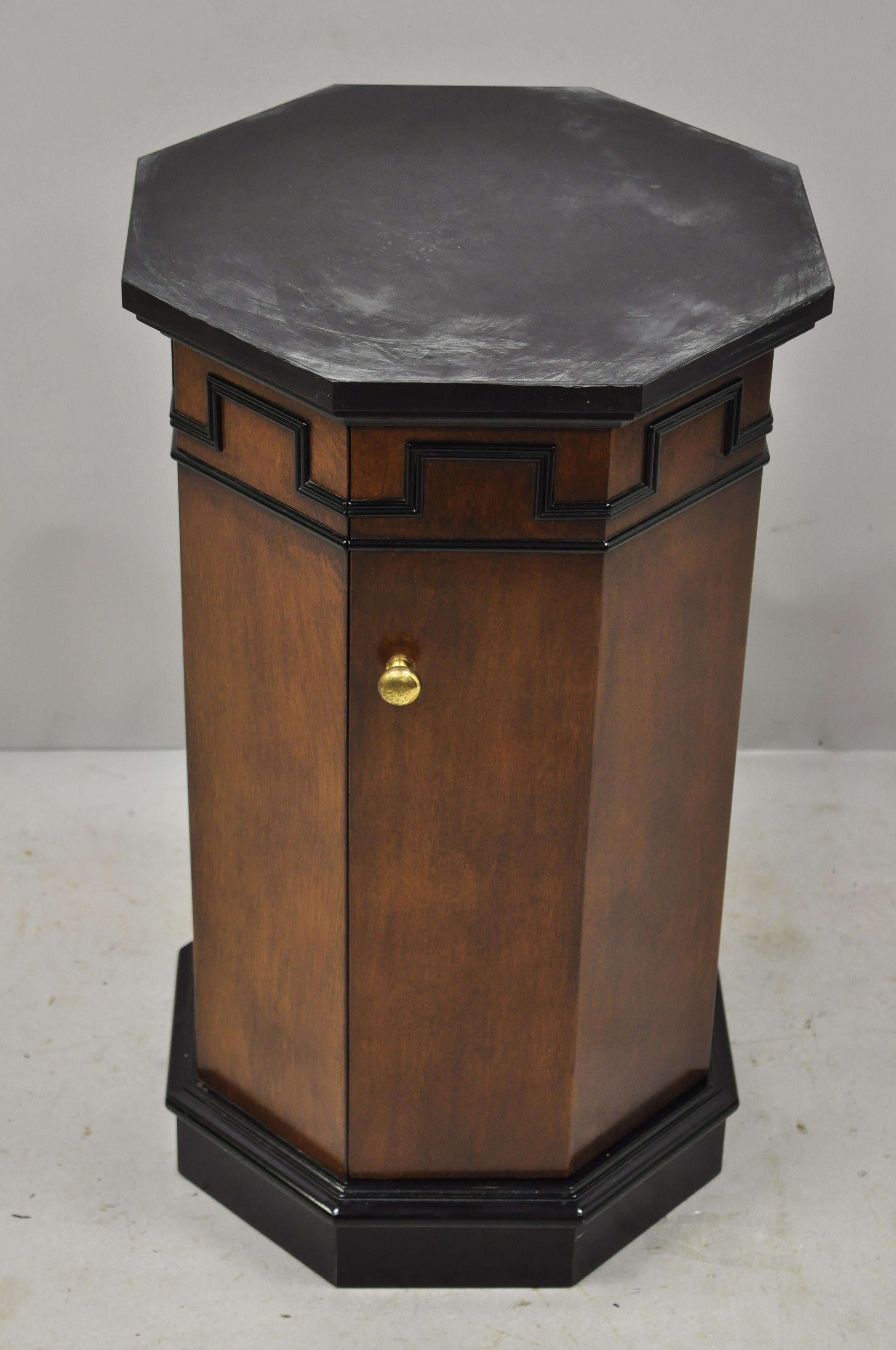 Vintage round slate top mahogany pedestal classical column cabinet storage stand. Item features a round slate top, black painted details, beautiful wood grain, 1 swing door, 1 wooden shelf, quality American craftsmanship, great style and form, circa