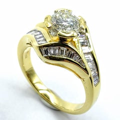 Vintage Round & Tapered Baguette Cut Diamond Engagement Ring in 18K Yellow Gold
