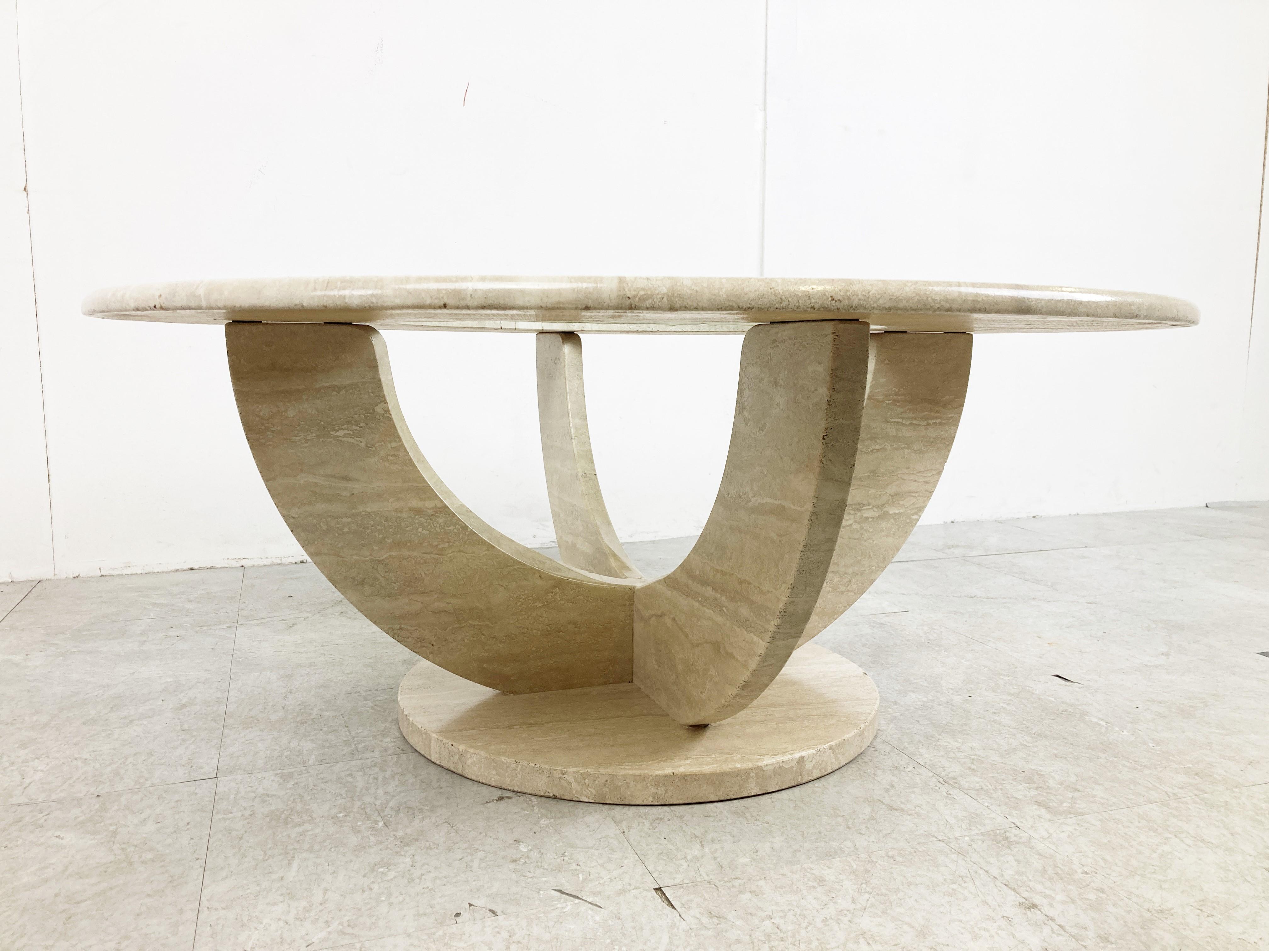 Vintage round travertine coffee table with a nicely shaped base and a glass and travertine round top. 

Good condition.

1970s - Italy

Dimensions
Height: 42cm/16.53