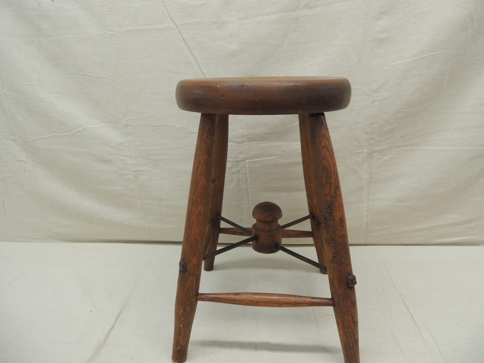 Vintage round wood work bench stool
X long screw rod stretcher. 
Size: 12” W x 12” D x 18” H
11” seat D.