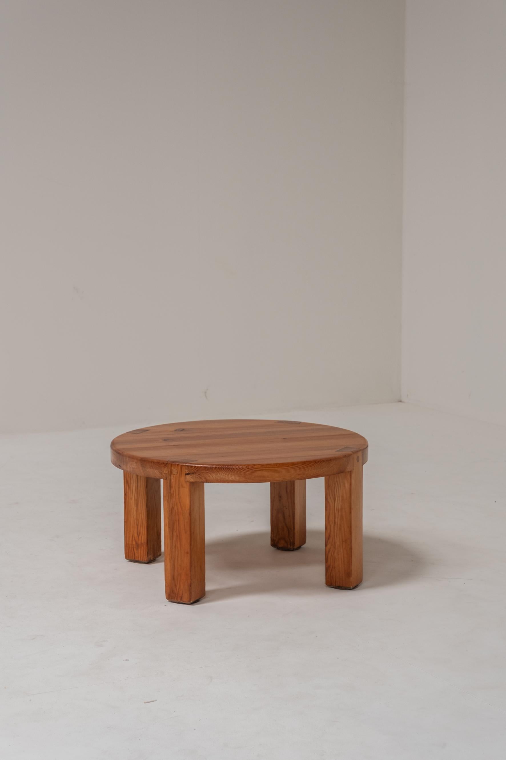 This beautifully handcrafted round wooden side table showcases timeless design and expert joinery, making it a standout piece in any interior. The legs are connected to the tabletop using traditional wooden wedge joints, a construction method that