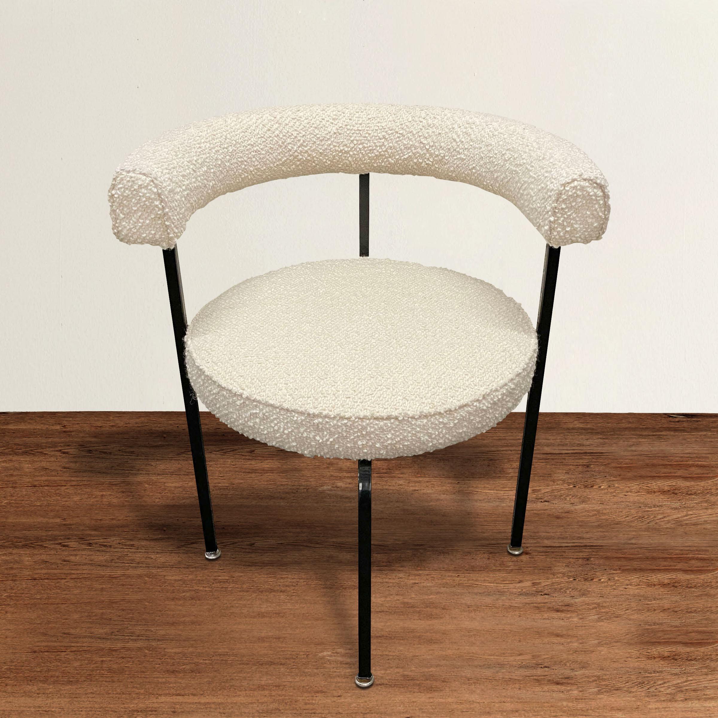 A chic sculptural vintage American roundback armchair newly upholstered in a chunky white wool bouclé, and newly painted steel frame. The perfect office or desk chair, or tucked in a corner of your living room or bedroom.