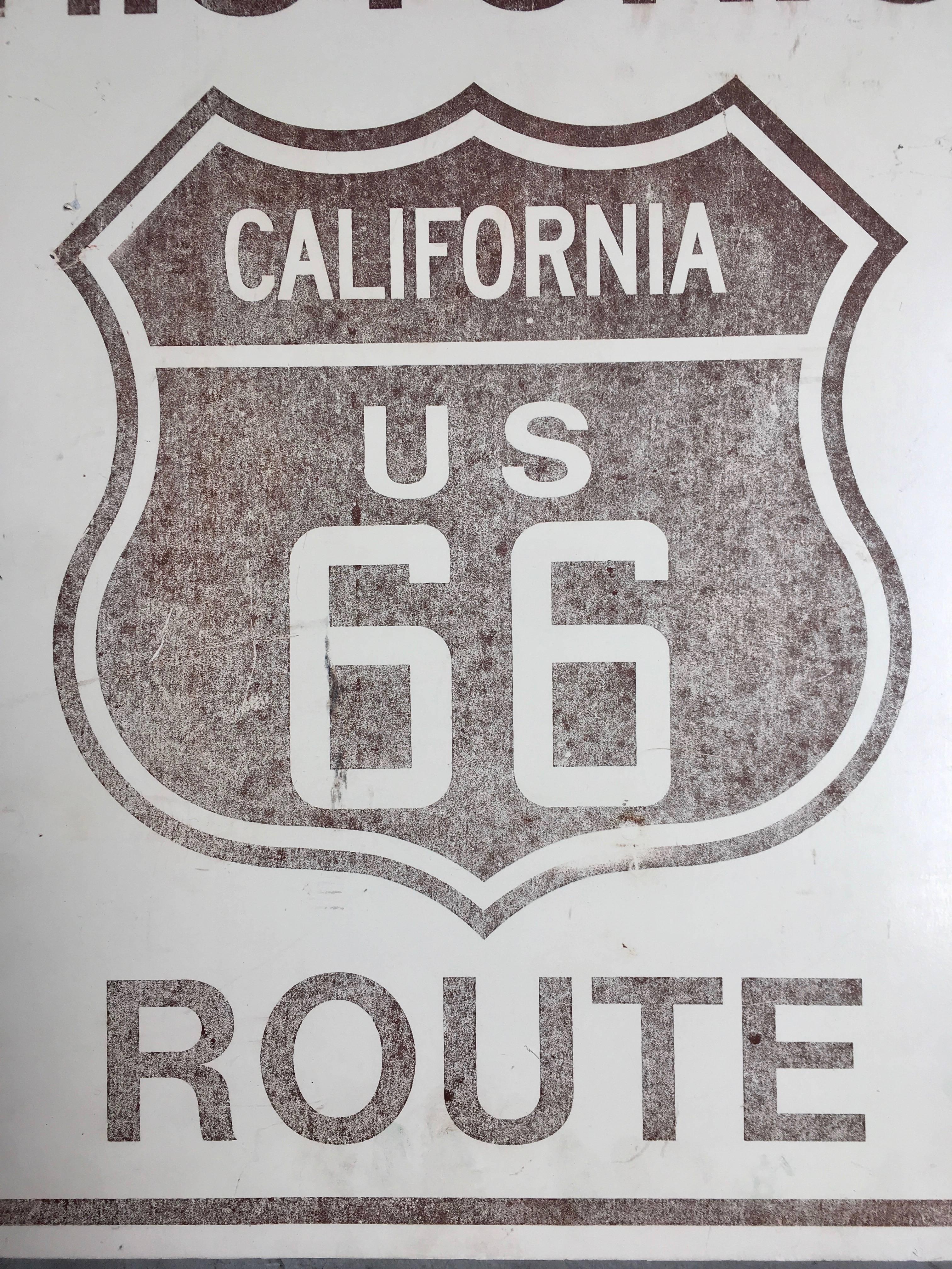 Unique vintage metal sign from Route 66. Great brown and white coloring with patina. Super rare original sign.