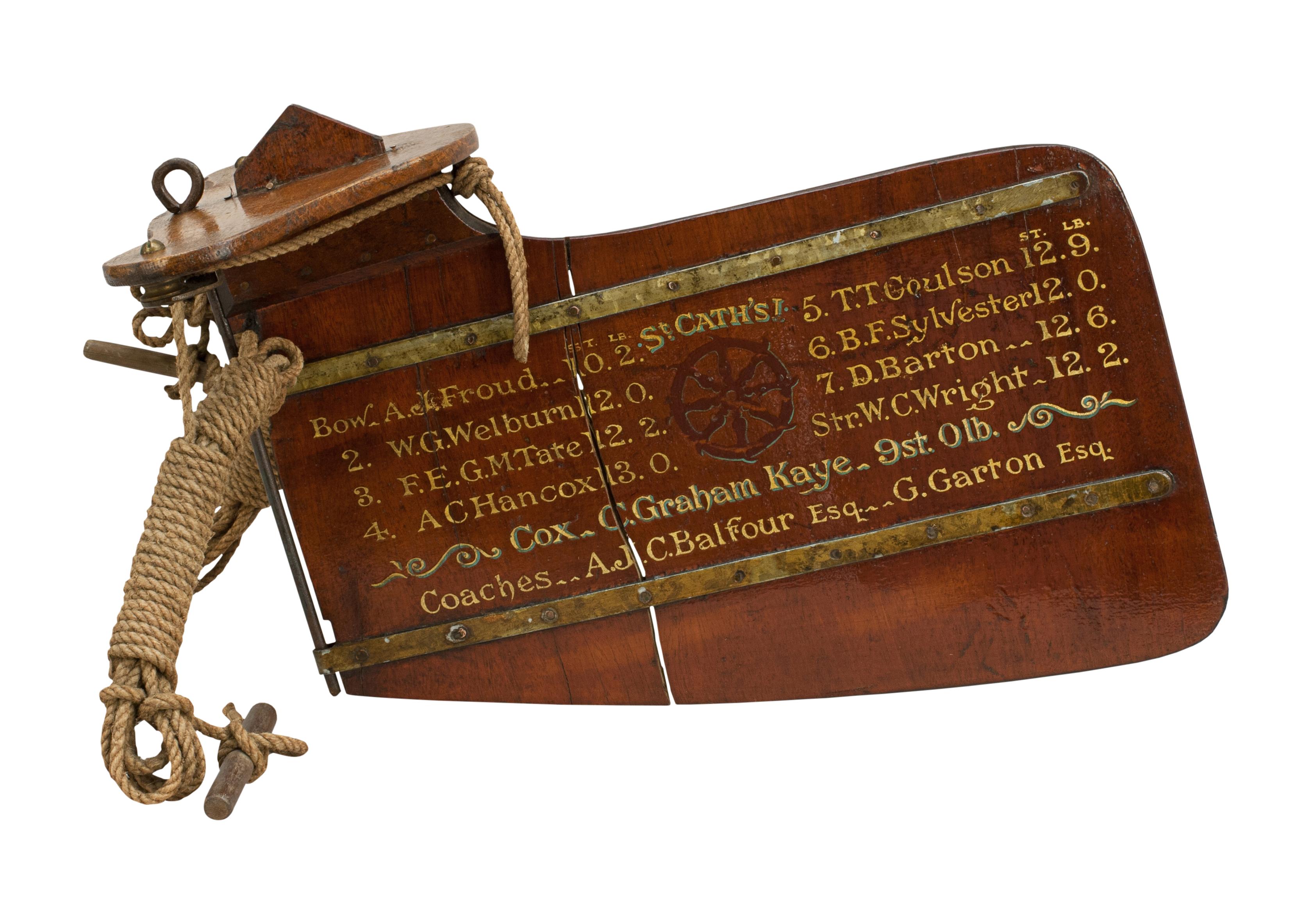 St Catharine's College commemorative rudder.
An original Oxford University presentation trophy rudder 'St Catharine's Boat Club, Torpids 1950' with gold calligraphy and college insignia. The rudder comes with the corresponding team photograph by