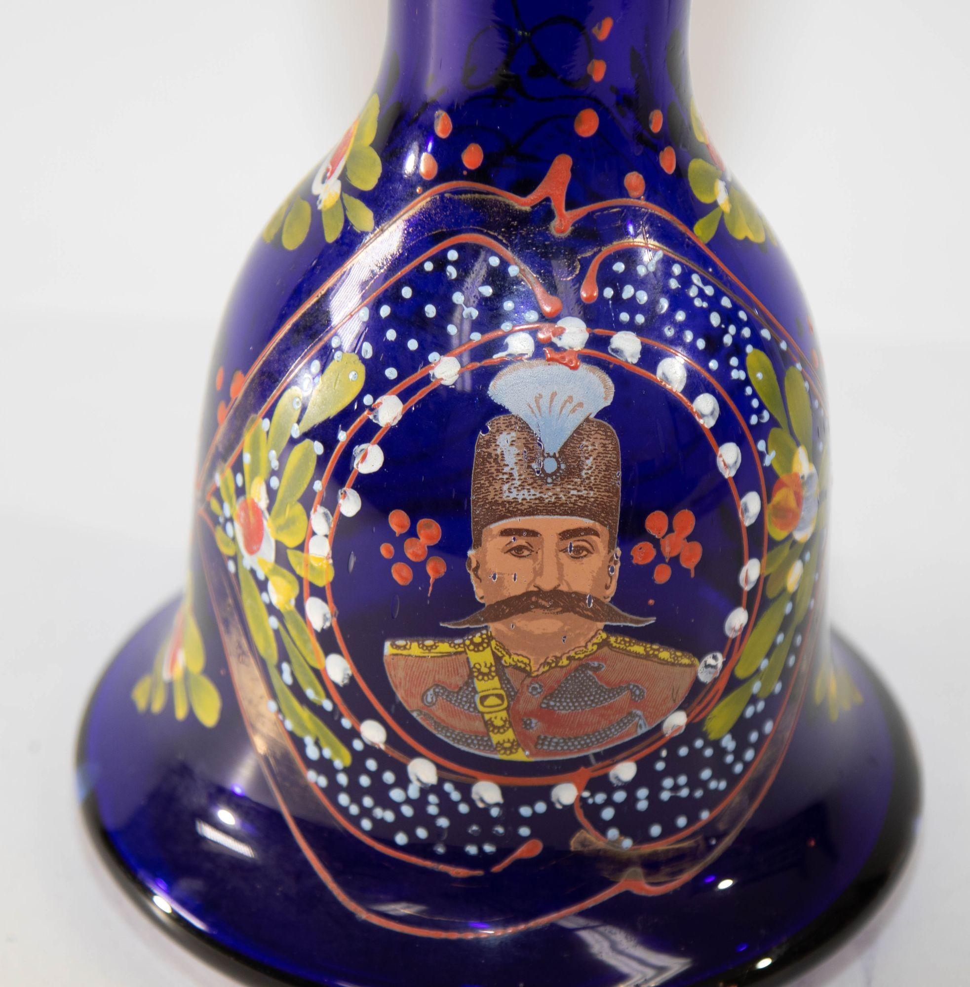 Royal blue opaque enameled Bohemian glass hookah base, or vase.
Bohemian glass hookah base with overlay enameled in yellow, amber, green, red, and white with additional gilt.
The elegant bell shape bowl huqqa’s base is hand-painted with corf flowers