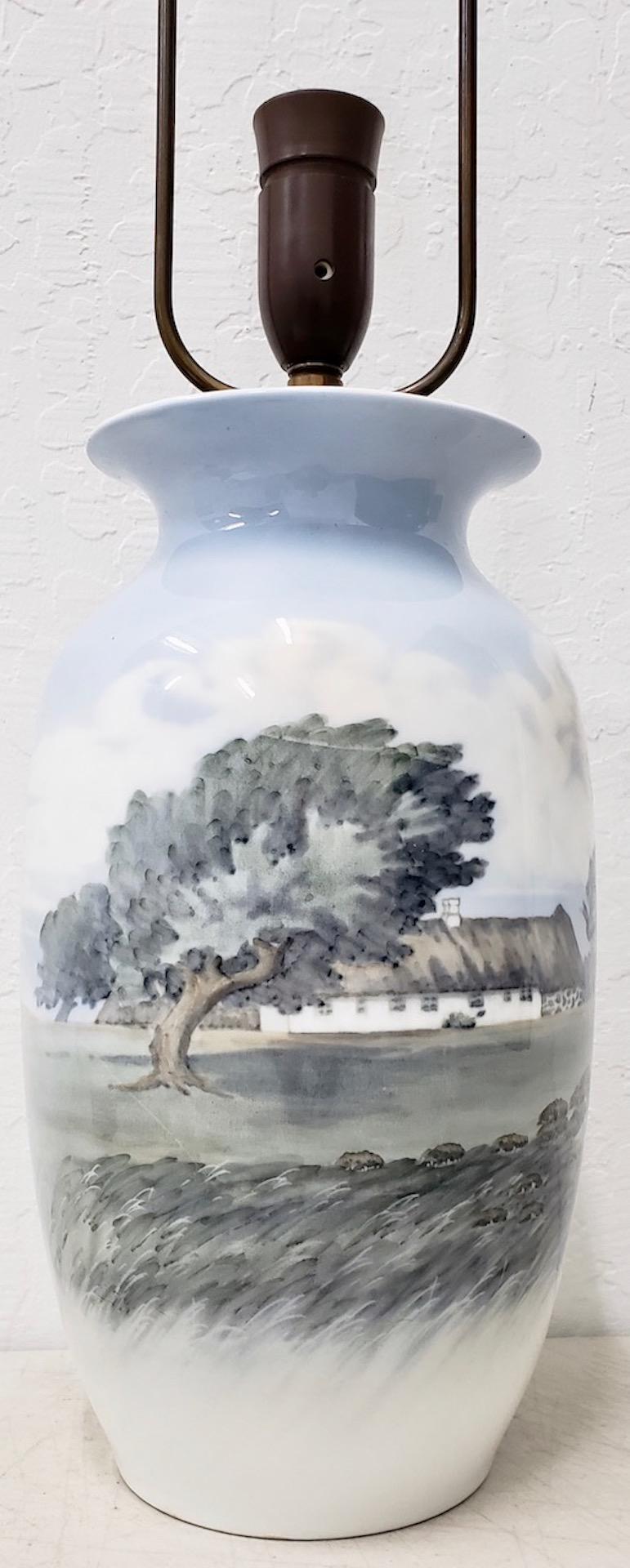 Vintage Royal Copenhagen country home vase converted to table lamp circa1920s

Beautiful vintage hand painted Royal Copenhagen vase converted into a table lamp.

The vase is very lovely and shows a few minor scuffs. No chips. No