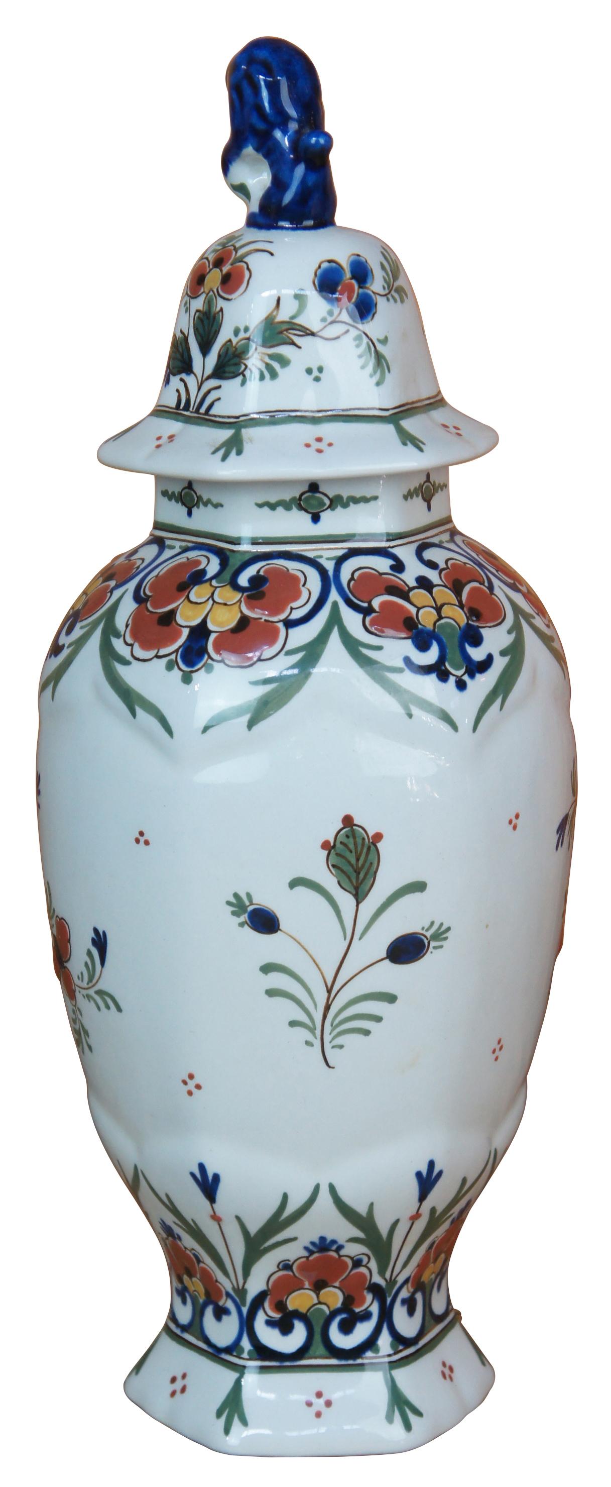 Royal Delft De Porceleyne Fles lidded jar. Hand painted with flowers and figural fu dog lid. Marked along underside.
 