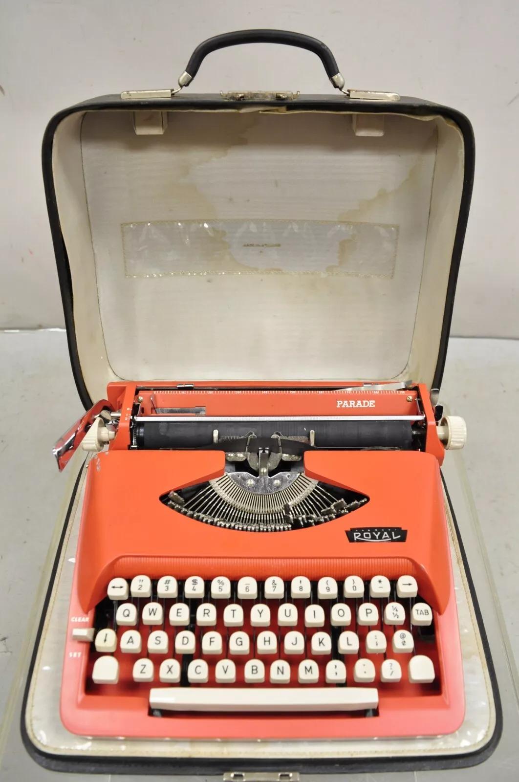 Vintage Royal Holland Parade Coral Red Mid Century Modern Portable Typewriter in Case. Circa Mid 20th Century. Measurements: Case, 4.5